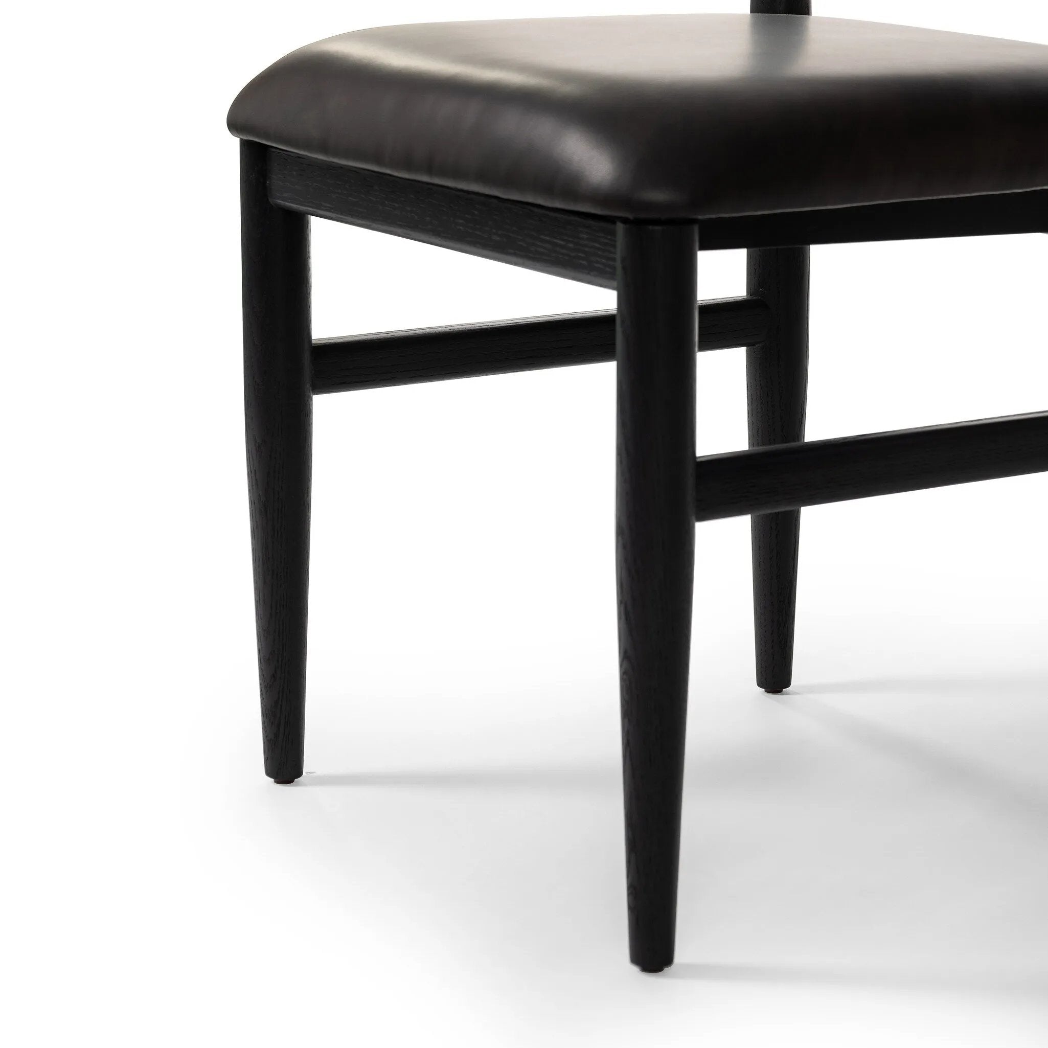 Featuring Mavery Sierra Espresso Armless Dining Chair by Four Hands at Amethyst Home. Classic midcentury form meets monochromatic comfort. The tapered-leg design of this oak dining chair is finished with an espresso-brown upholstered cushion for a sleek, inviting seat.
Collection: AshfordColors: Sierra Espresso, Brushed Ebony Oak, Brushed Ebony Oak Vene. Amethyst Home provides interior design, new home construction design consulting, vintage area rugs, and lighting in the Winter Garden metro area.