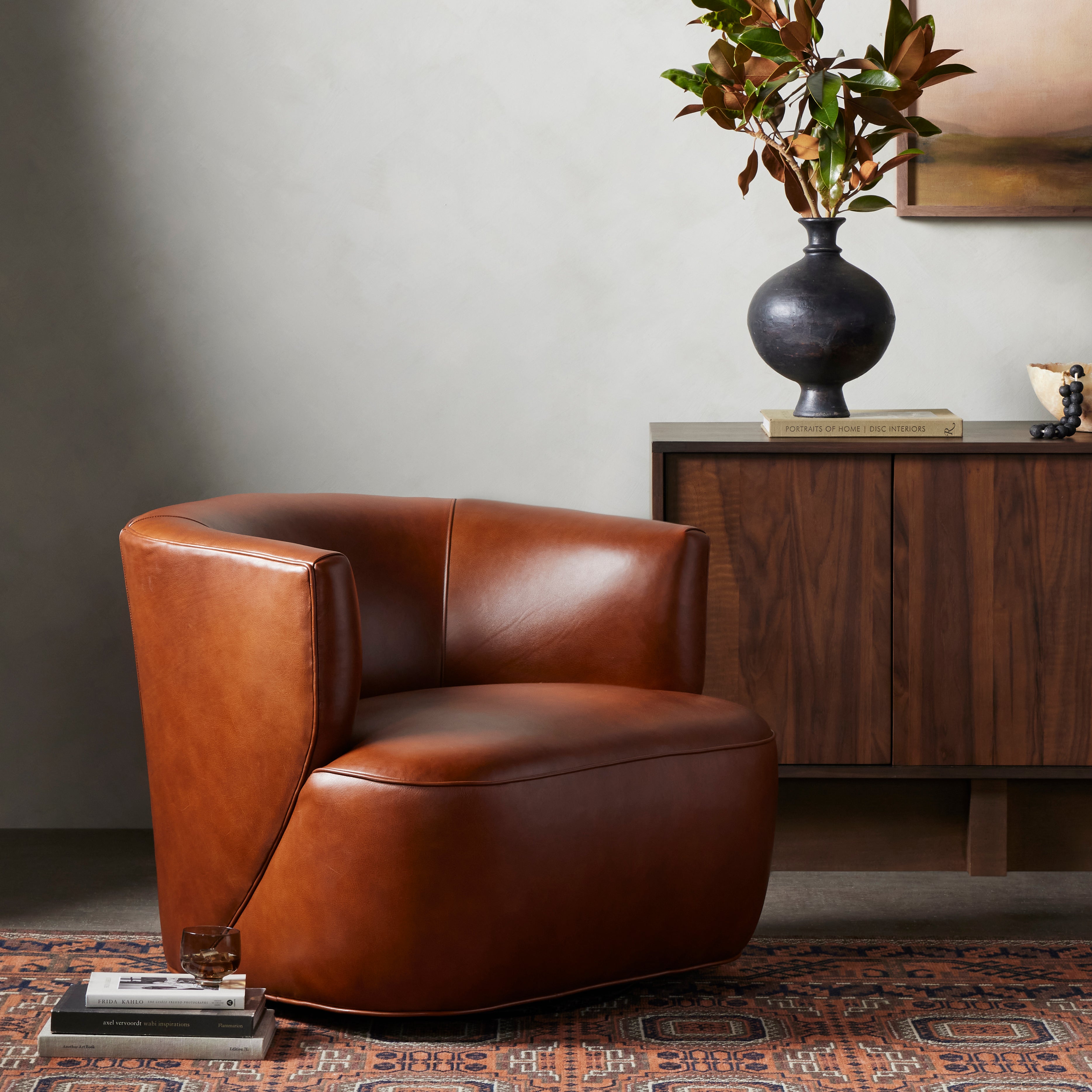 Sultry and sensible. Warm top-grain leather hugs the curves of modern-minded seating, with a hidden swivel for a functional touch. Amethyst Home provides interior design, new construction, custom furniture and area rugs in the Austin metro area