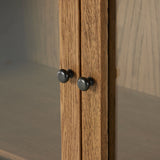 Drifted oak frames the interior shelving of this cabinet. Glass doors allow for prized possessions to dazzle on full display while spacious cabinets add out-of-view storage. Amethyst Home provides interior design, new construction, custom furniture, and area rugs in the Salt Lake City metro area.