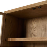 Drifted oak frames the interior shelving of this cabinet. Glass doors allow for prized possessions to dazzle on full display while spacious cabinets add out-of-view storage. Amethyst Home provides interior design, new construction, custom furniture, and area rugs in the Scottsdale metro area.