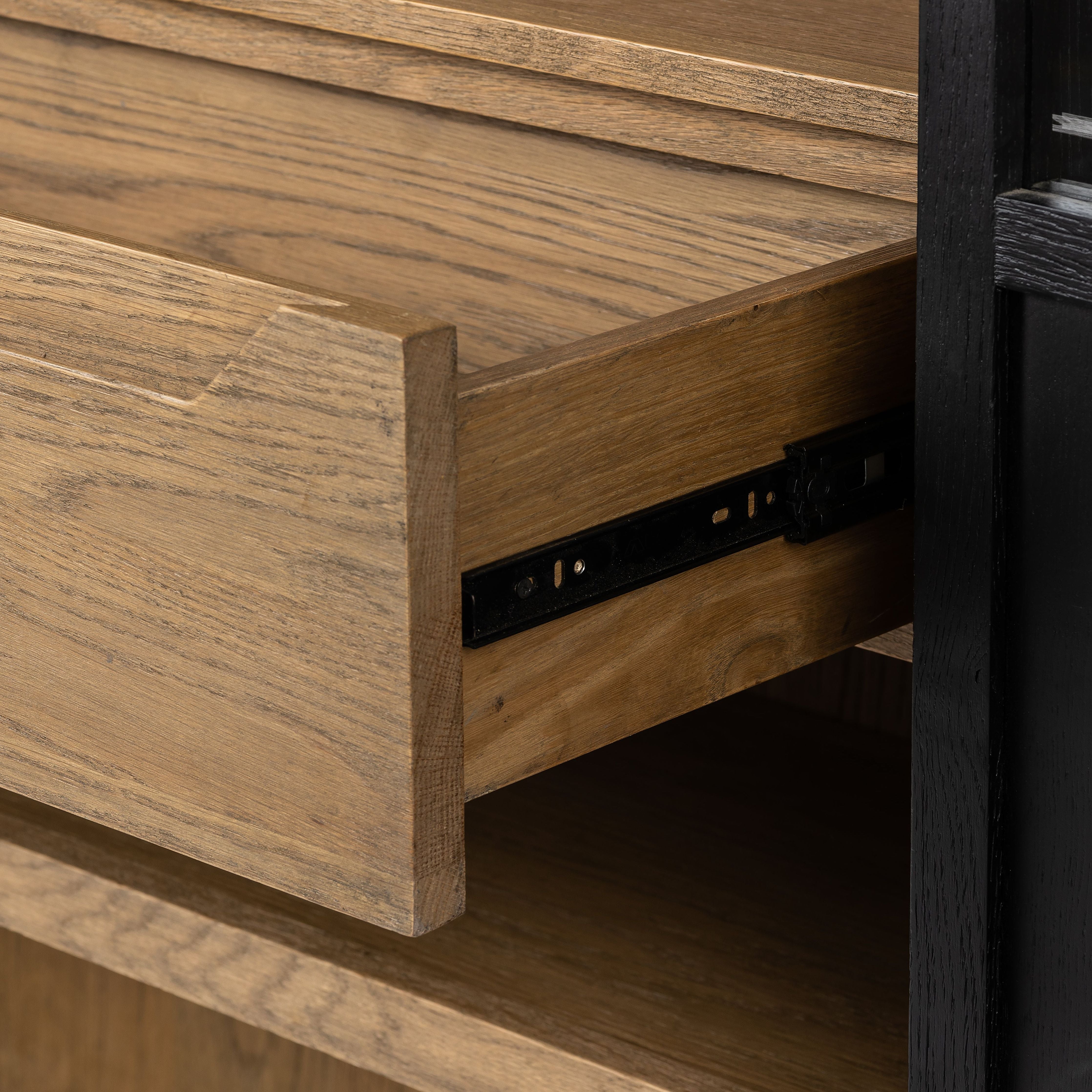 Featuring Millie Matte Black Panel & Glass Door Cabinet by Four Hands at Amethyst Home. Matte black drifted oak frames lighter interior shelving for subtle but striking contrast. Glass doors allow for prized possessions to dazzle on full display while spacious cabinets add out-of-view storage.Overall Dimensions: 47.25"W x 17.75"L x 82.75"H
Collection: IrondaleColors: Drifted Oak Sol. Amethyst Home provides interior design, new construction, custom furniture, and area rugs in the Austin metro area.