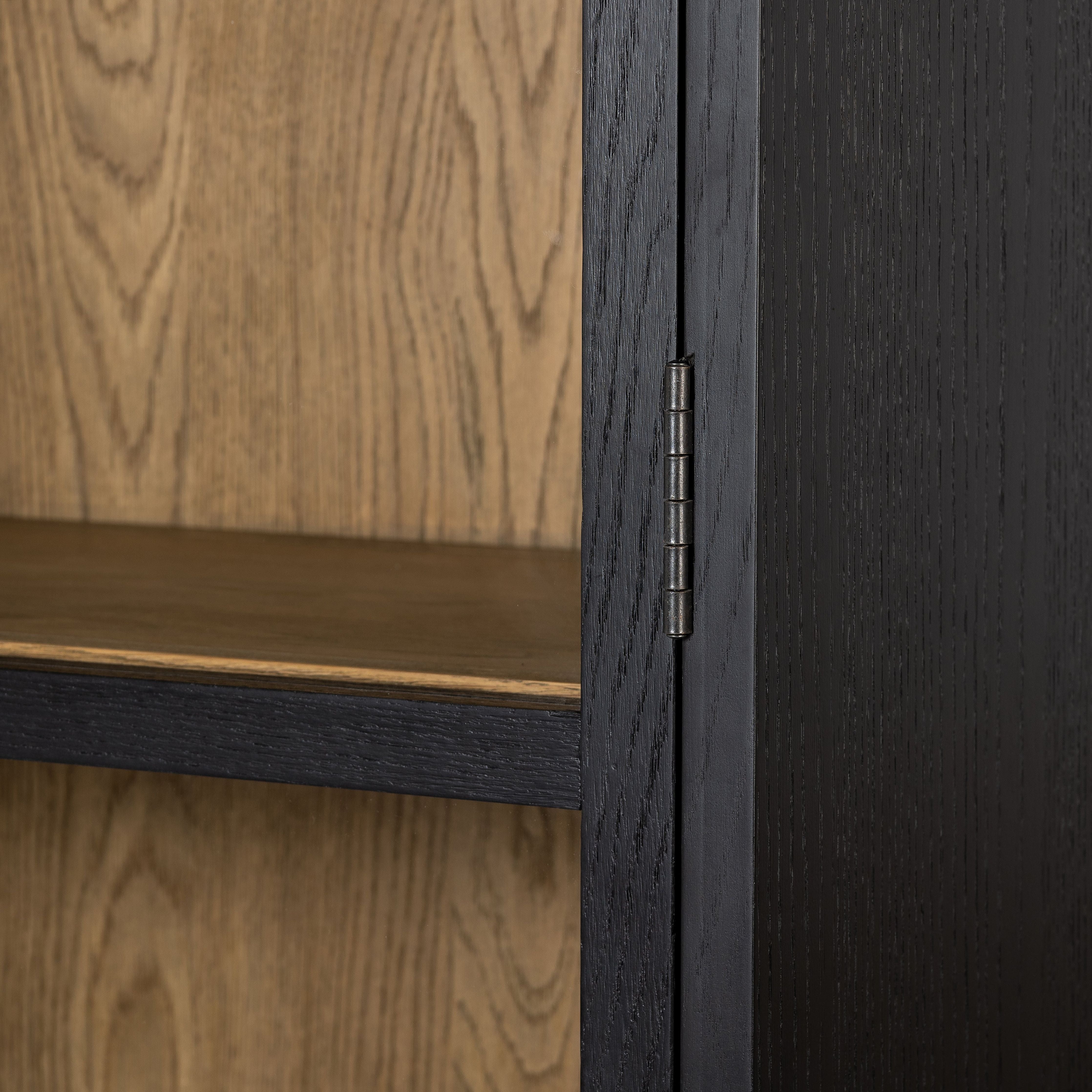 Featuring Millie Matte Black Panel & Glass Door Cabinet by Four Hands at Amethyst Home. Matte black drifted oak frames lighter interior shelving for subtle but striking contrast. Glass doors allow for prized possessions to dazzle on full display while spacious cabinets add out-of-view storage.Overall Dimensions: 47.25"W x 17.75"L x 82.75"H
Collection: IrondaleColors: Drifted Oak Sol. Amethyst Home provides interior design, new construction, custom furniture, and area rugs in the Dallas metro area.