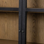Featuring Millie Matte Black Panel & Glass Door Cabinet by Four Hands at Amethyst Home. Matte black drifted oak frames lighter interior shelving for subtle but striking contrast. Glass doors allow for prized possessions to dazzle on full display while spacious cabinets add out-of-view storage.Overall Dimensions: 47.25"W x 17.75"L x 82.75"H
Collection: IrondaleColors: Drifted Oak . Amethyst Home provides interior design, new construction, custom furniture, and area rugs in the San Diego metro area.