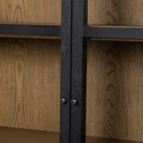 Featuring Millie Matte Black Panel & Glass Door Cabinet by Four Hands at Amethyst Home. Matte black drifted oak frames lighter interior shelving for subtle but striking contrast. Glass doors allow for prized possessions to dazzle on full display while spacious cabinets add out-of-view storage.Overall Dimensions: 47.25"W x 17.75"L x 82.75"H
Collection: IrondaleColors: Drifted Oak . Amethyst Home provides interior design, new construction, custom furniture, and area rugs in the San Diego metro area.