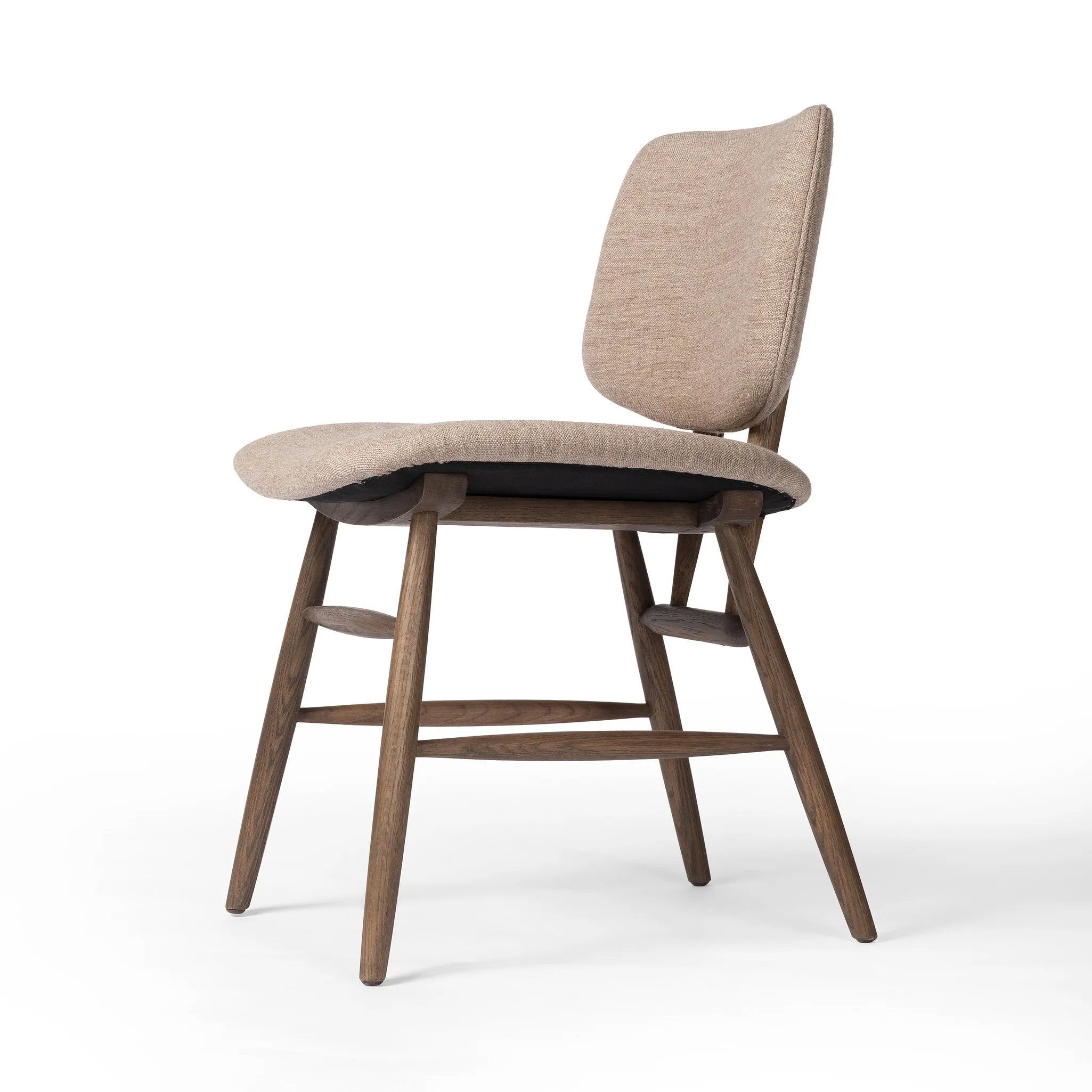 Featuring Montague Alcala Fawn Dining Chair by Four Hands at Amethyst Home. A textbook midcentury design with upholstered molded cushions pair style and comfort in one dining chair. Alternating joint positions add an unexpected architectural element to the piece. Performance fabrics are specially created to withstand spills, stains, high traffic and wear, e. Amethyst Home provides interior design, new home construction design consulting, vintage area rugs, and lighting in the Nashville metro area.