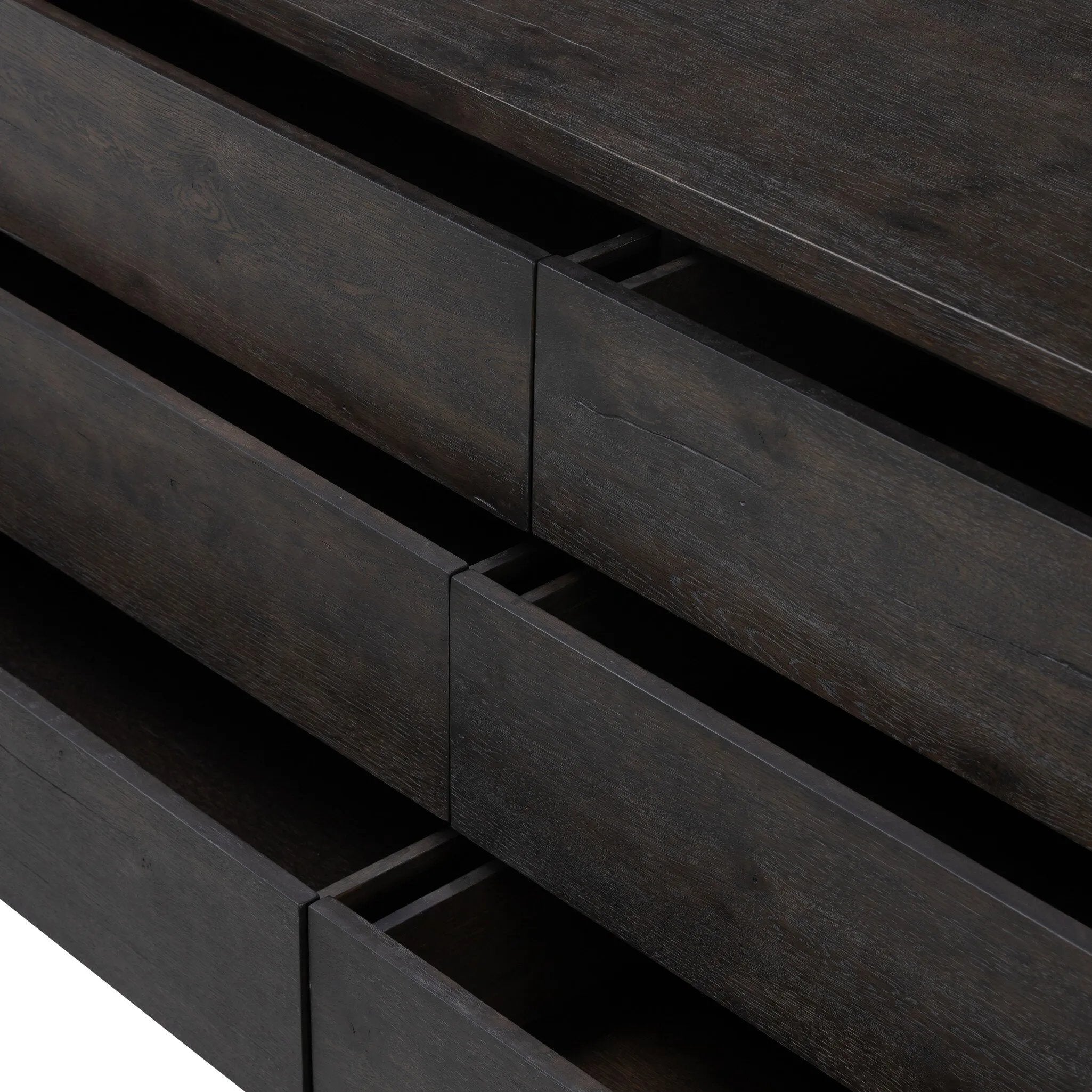 Featuring Noeline Smoked Black Oak Veneer 6 Drawer Dresser by Four Hands at Amethyst Home. Topped with a thick plank of solid oak, this extra-wide dresser blends modern lines and warm character with six roomy drawers, slightly curved corners, and solid square legs. Seamless drawer fronts have a push-latch mechanism. Made from solid oak and veneer in a smoky. Amethyst Home provides interior design, new home construction design consulting, vintage area rugs, and lighting in the San Diego metro area.