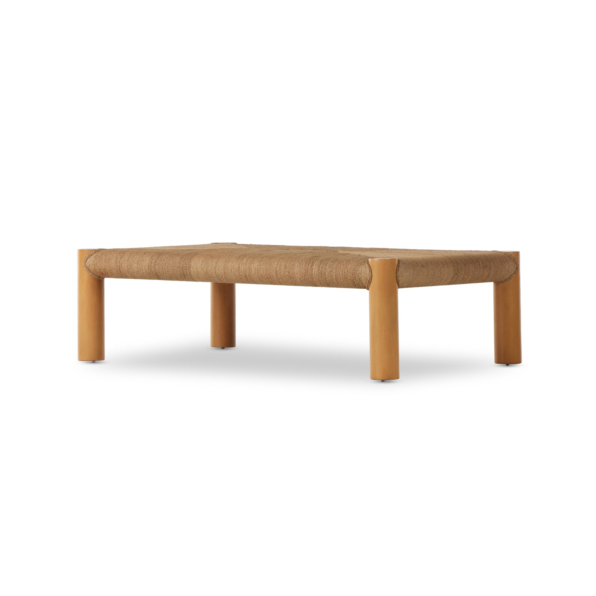 The traditional coffee table gets a textural twist. Chunky column legs of light-washed mahogany support a rectangular tabletop of braided sugar palm leaves. Amethyst Home provides interior design, new construction, custom furniture, and area rugs in the Kansas City metro area.