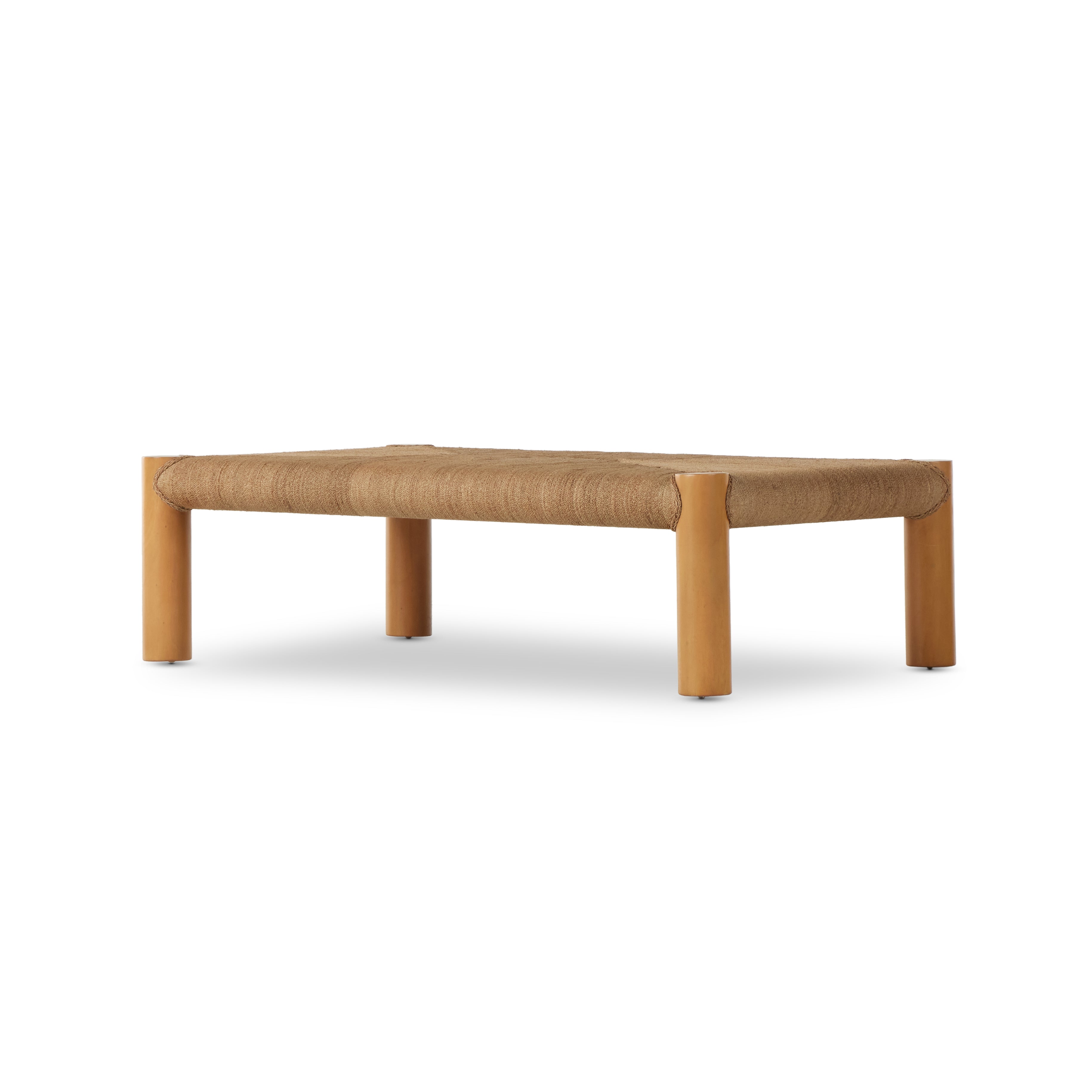 The traditional coffee table gets a textural twist. Chunky column legs of light-washed mahogany support a rectangular tabletop of braided sugar palm leaves. Amethyst Home provides interior design, new construction, custom furniture, and area rugs in the Kansas City metro area.