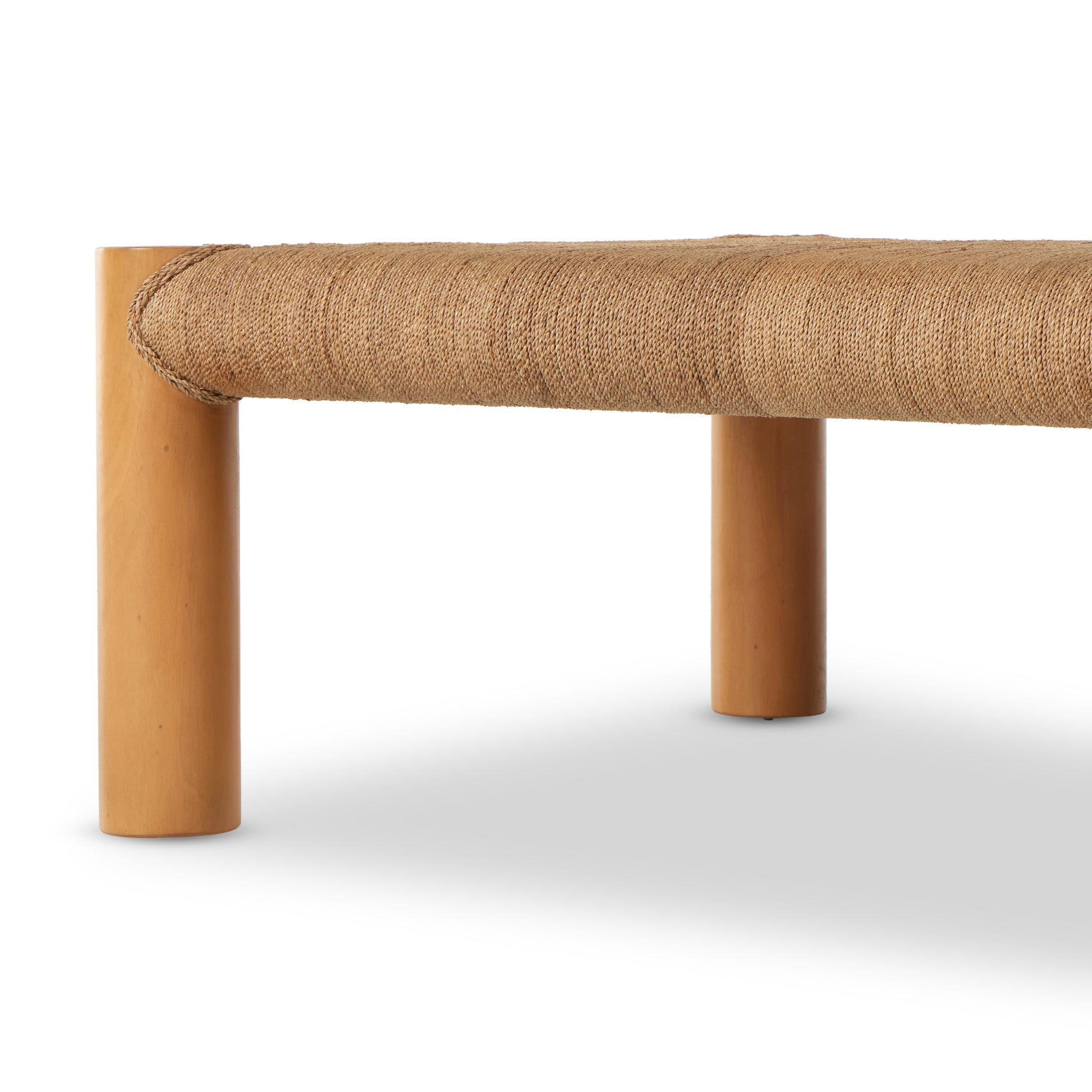 The traditional coffee table gets a textural twist. Chunky column legs of light-washed mahogany support a rectangular tabletop of braided sugar palm leaves. Amethyst Home provides interior design, new construction, custom furniture, and area rugs in the Laguna Beach metro area.