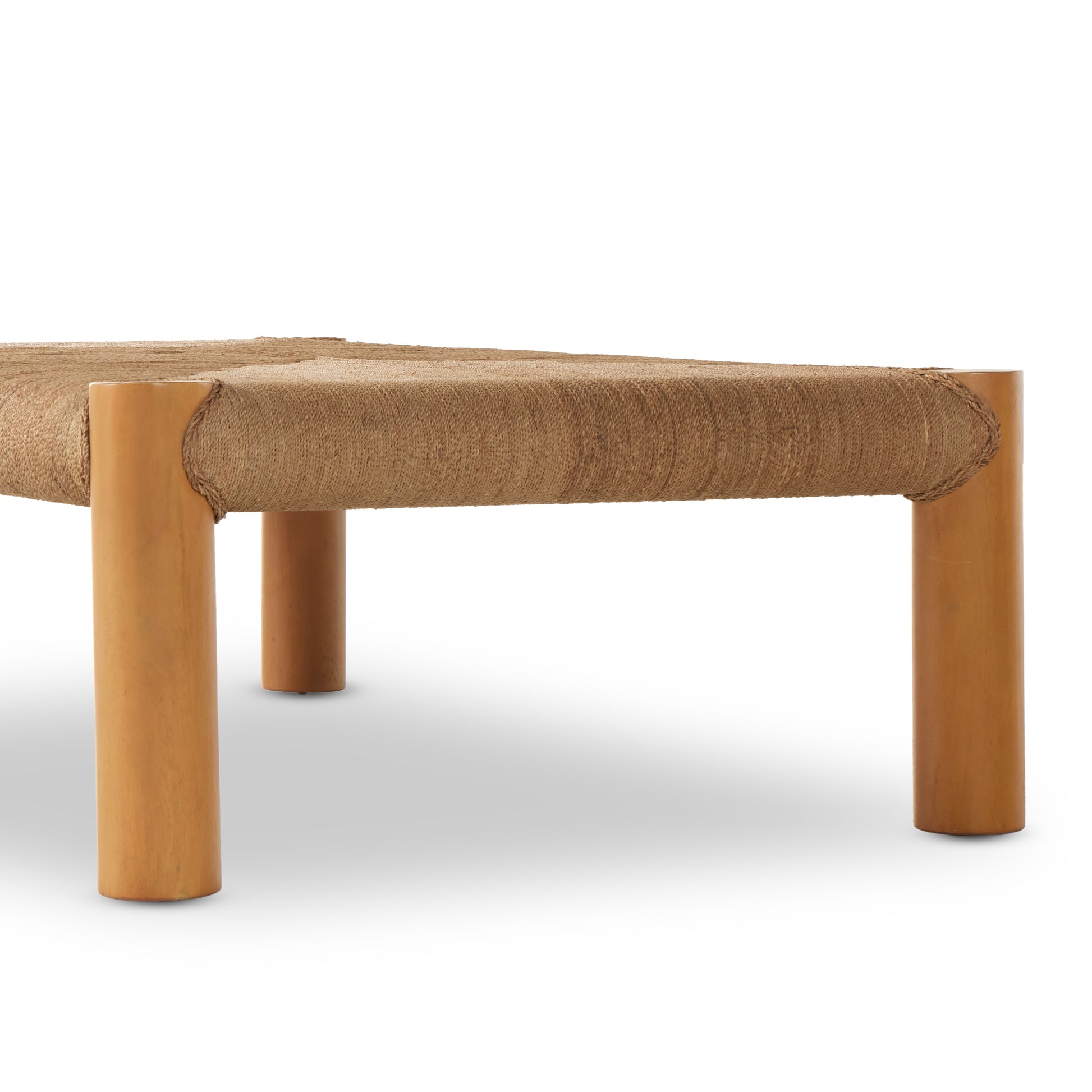 The traditional coffee table gets a textural twist. Chunky column legs of light-washed mahogany support a rectangular tabletop of braided sugar palm leaves. Amethyst Home provides interior design, new construction, custom furniture, and area rugs in the San Diego metro area.
