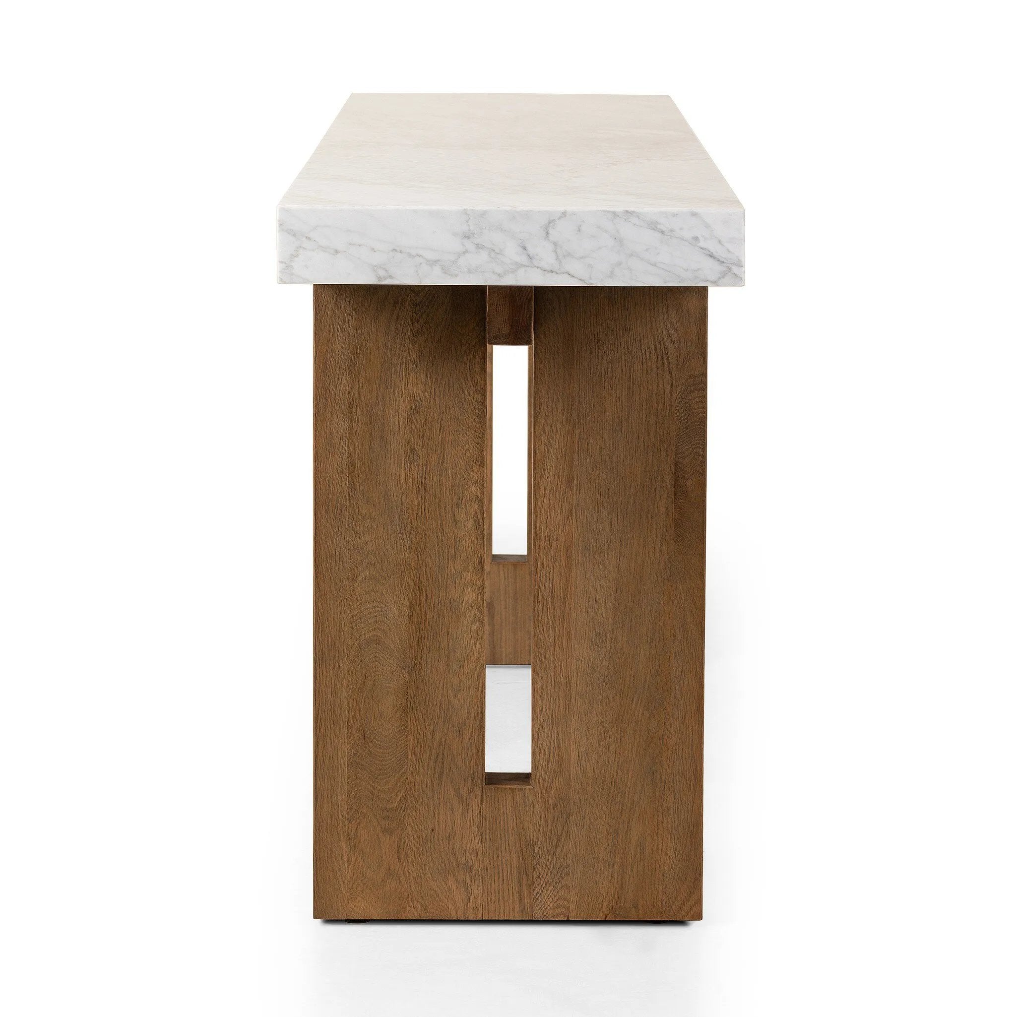 Featuring Olympia White Carrera Marble Console Table by Four Hands at Amethyst Home. Structured and geometric, an open-style console table pairs smoked oak veneer with white marble, for a sophisticated material mix.Collection: HughesColors: White Carrera Marble ,Smoked Oak VeneerMaterials: Carrara Solid ,Thick Oak Veneer ,Poplar Plywood Weight: 240.3 lbs. Amethyst Home provides interior design, new home construction design consulting, vintage area rugs, and lighting in the Omaha metro area.