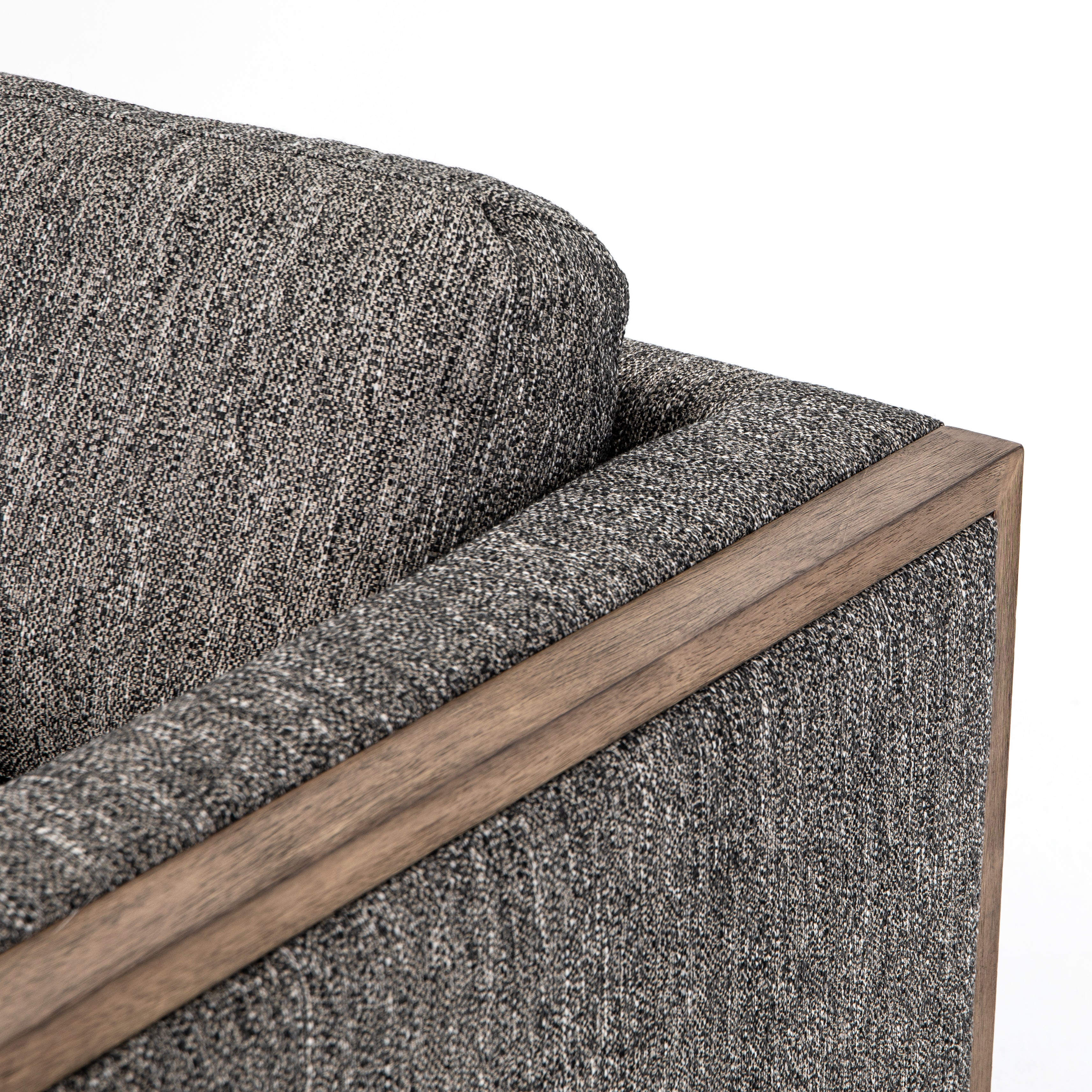 Crisp, clean comfort. Charcoal-colored upholstery of performance grade cradles within an exposed parawood frame, for detail-driven contrast. Performance fabrics are specially created to withstand spills, stains, high traffic and wear, ensuring long-term comfort and unmatched durability. Amethyst Home provides interior design, new construction, custom furniture, and area rugs in the Nashville metro area.