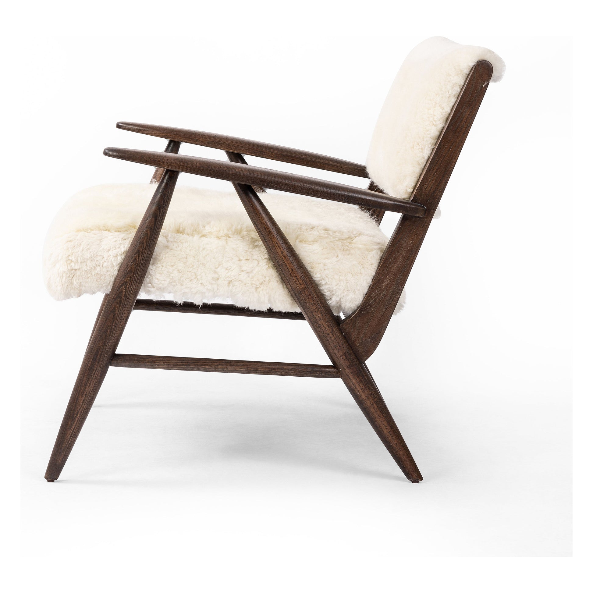 A modern take on the vintage school chair, upholstered in plush cream shearling of 100% sheepskin. Perfect as an accent chair or in pairs. Amethyst Home provides interior design, new construction, custom furniture, and area rugs in the Portland metro area.