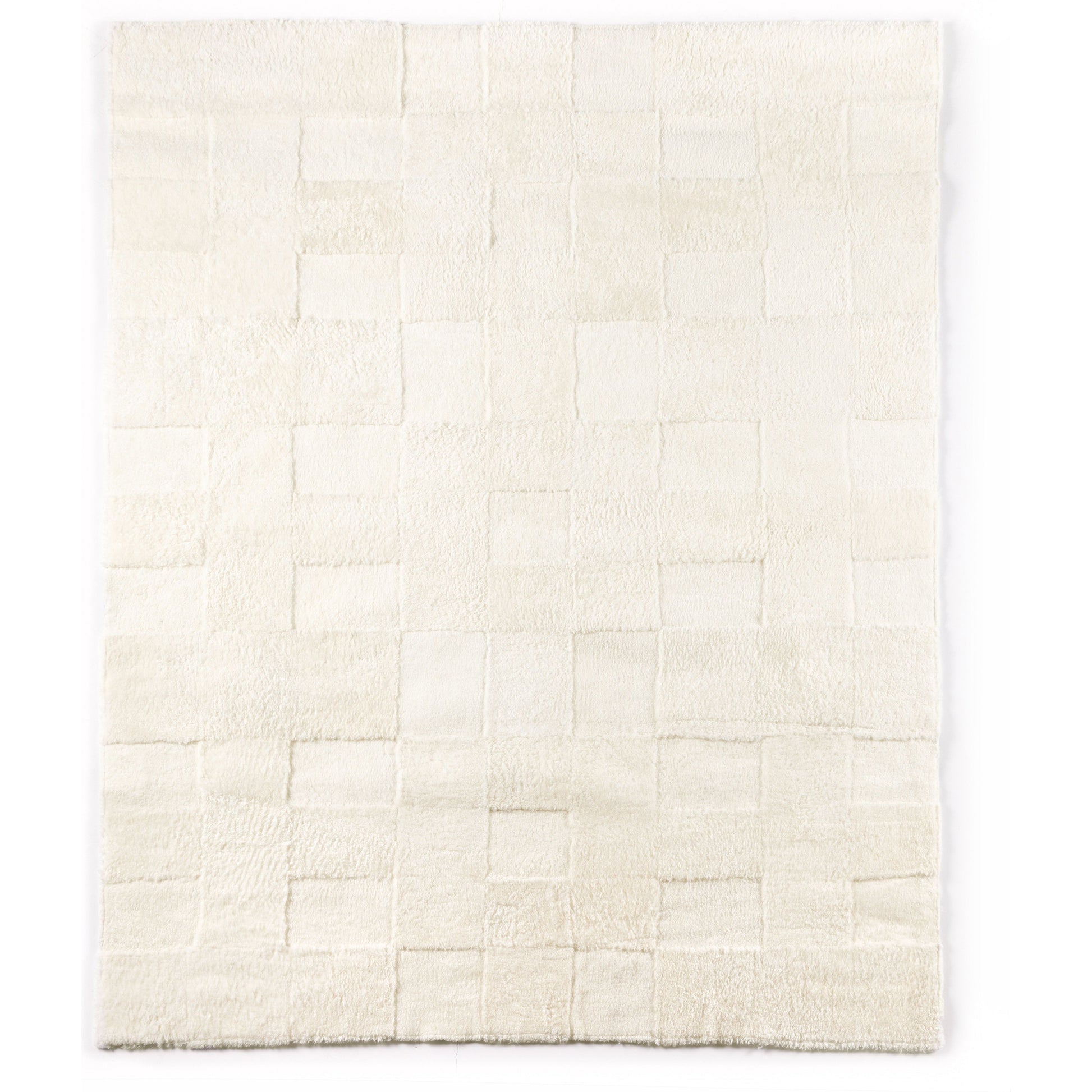 Patchwork Cream Shorn Shearling Rug is shaved to different heights and stitched together to create a tonal checked pattern for a modern yet classic look. Subtle color variations bring a natural, more organic feel to the rug. The material, pattern, and hues come together to craft an unexpected bold style. Amethyst Home provides interior design services, furniture, rugs, and lighting in Des Moines area.