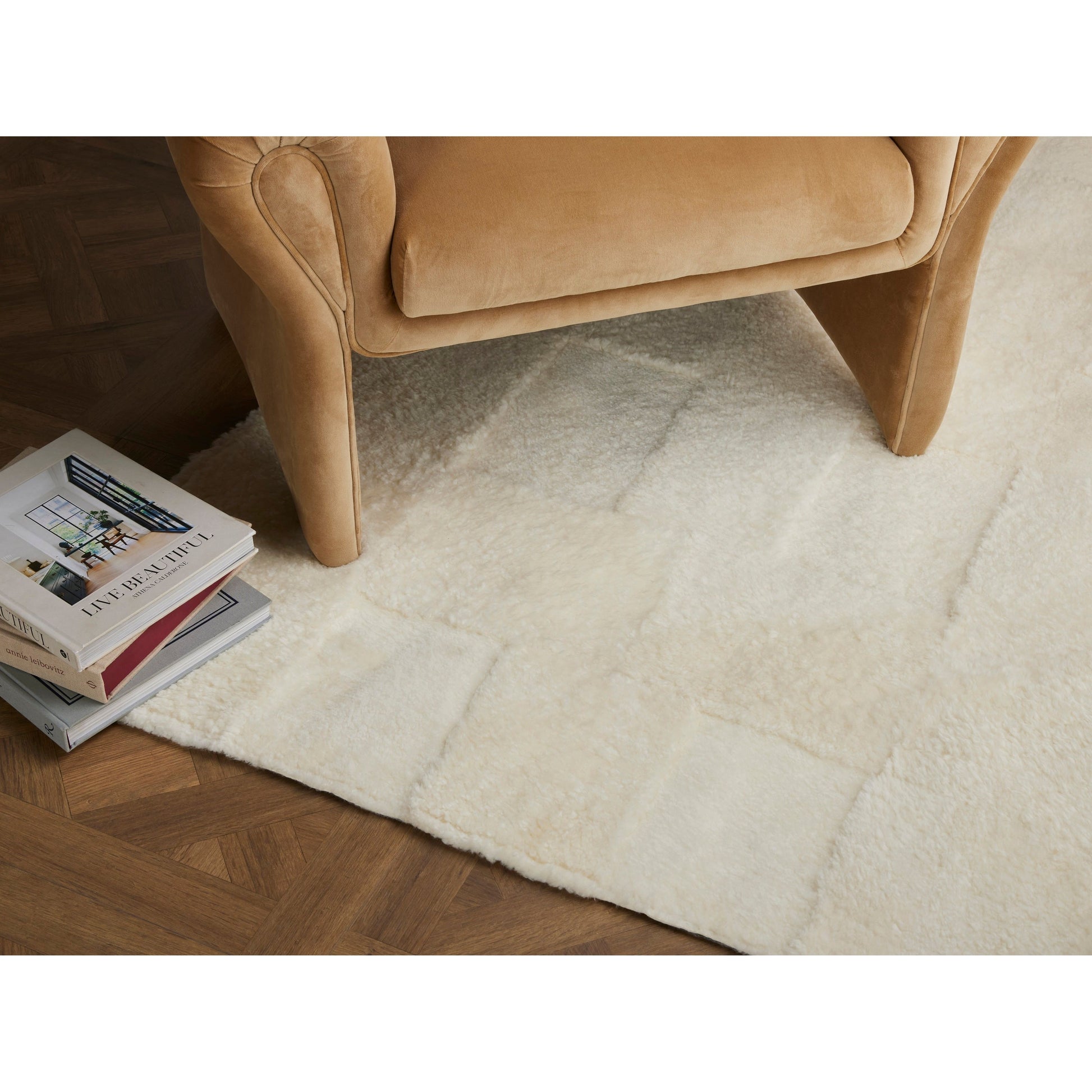 Patchwork Cream Shorn Shearling Rug is shaved to different heights and stitched together to create a tonal checked pattern for a modern yet classic look. Subtle color variations bring a natural, more organic feel to the rug. The material, pattern, and hues come together to craft an unexpected bold style. Amethyst Home provides interior design services, furniture, rugs, and lighting in Home Seattle metro area.