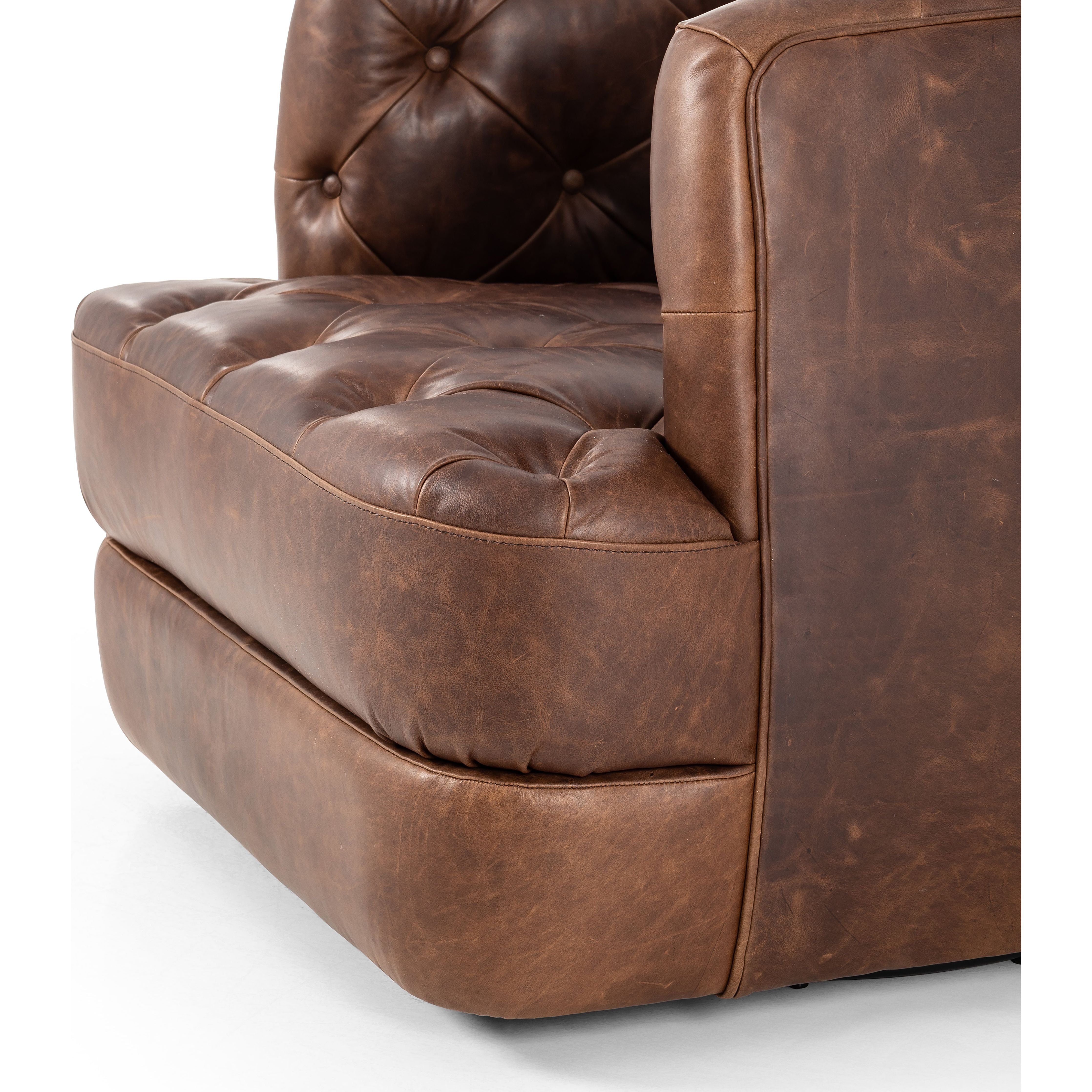 Featuring Paul Raleigh Cigar Swivel Chair by Four Hands at Amethyst Home. Old English-inspired top-grain leather is finished with a soft hand for a vintage, lived-in look on this traditionally inspired chair. Handcrafted in Italy, the richness of this distinctive, full-bodied leather develops an even-richer patina over time. Button tufting texturizes a comfortably curved back a. Amethyst Home provides interior design, new construction, custom furniture, and area rugs in the Kansas City metro area.