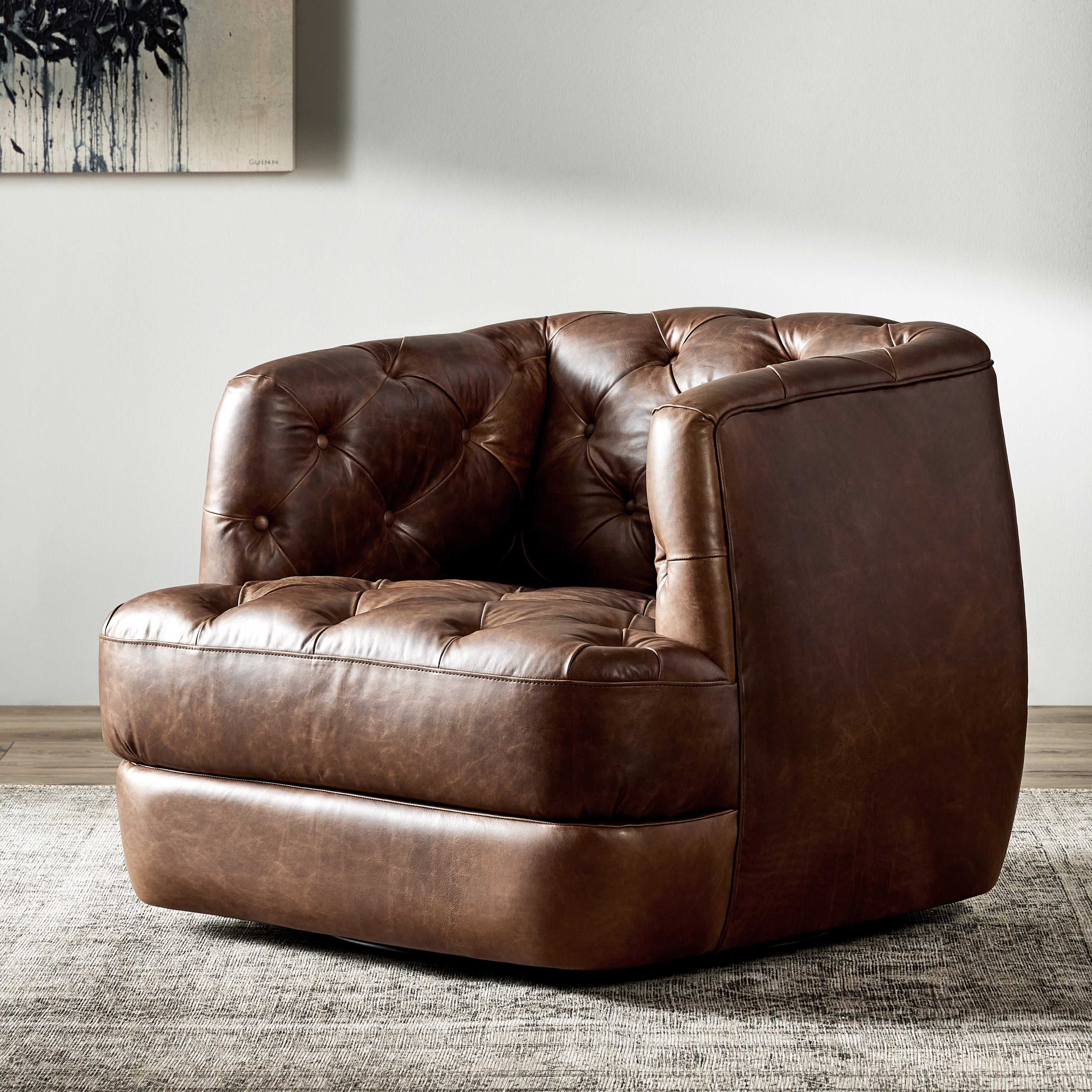 Featuring Paul Raleigh Cigar Swivel Chair by Four Hands at Amethyst Home. Old English-inspired top-grain leather is finished with a soft hand for a vintage, lived-in look on this traditionally inspired chair. Handcrafted in Italy, the richness of this distinctive, full-bodied leather develops an even-richer patina over time. Button tufting texturizes a comfortably curved back and sid. Amethyst Home provides interior design, new construction, custom furniture, and area rugs in the Omaha metro area.