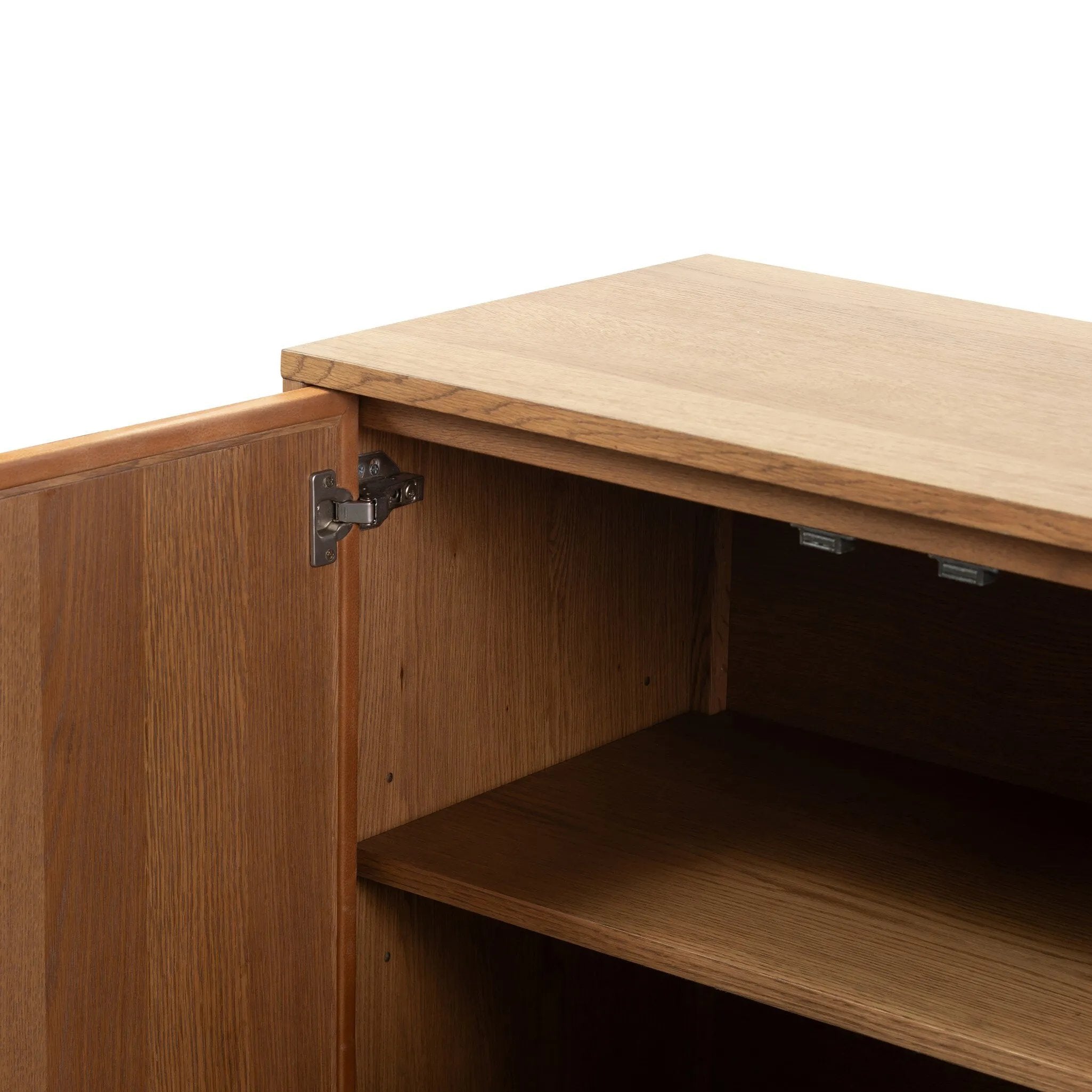 Smaller scale cabinetry of amber-finished oak, with door fronts of cognac top-grain leather and inset legs.Collection: Bolto Amethyst Home provides interior design, new home construction design consulting, vintage area rugs, and lighting in the Los Angeles metro area.