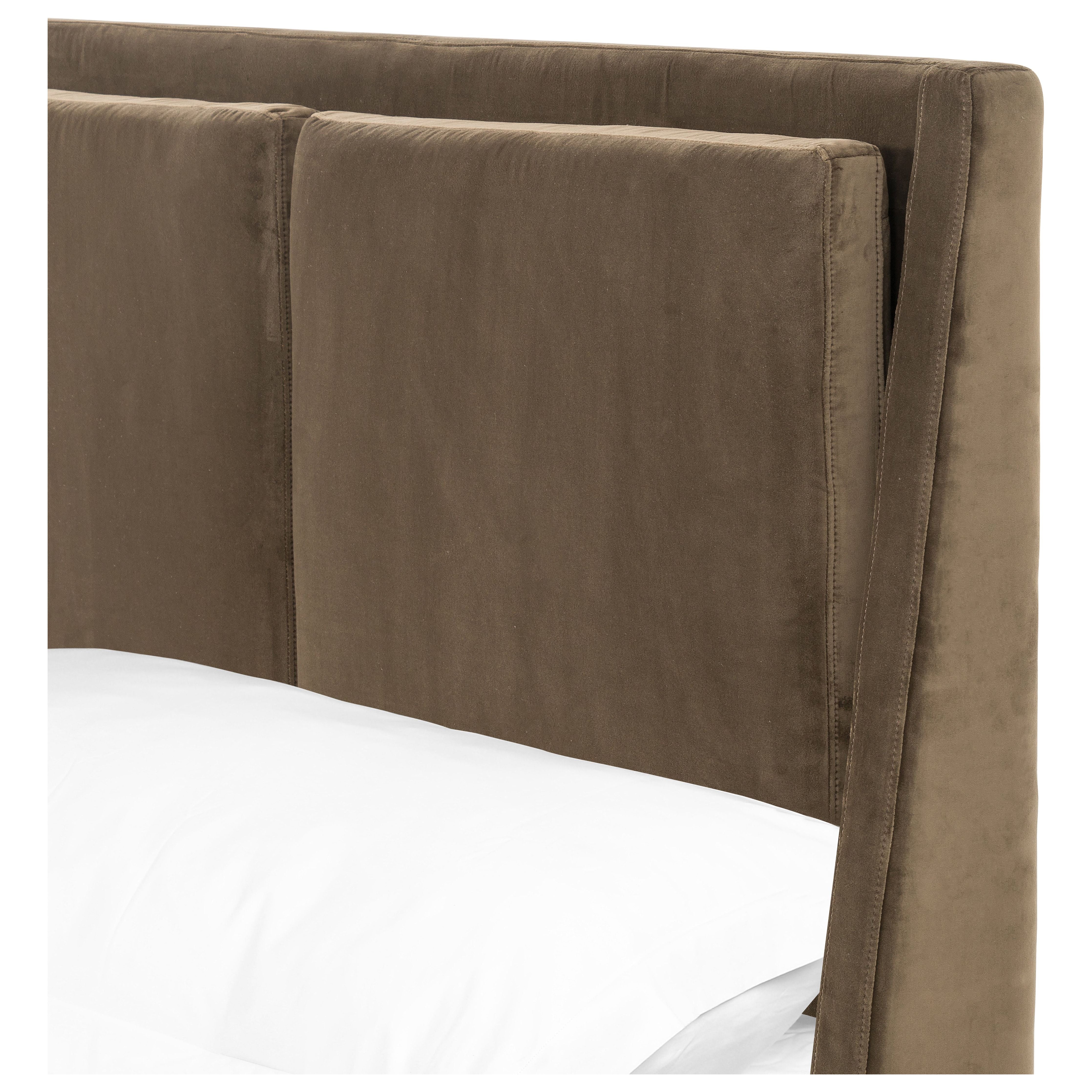 Upholstered in a velvety olive with subtle highs and lows that change in appearance depending on the direction of the fabric's nap. Fixed headboard cushioning for adds texture and comfort, while tapered oak legs lend a low-profile look. Amethyst Home provides interior design, new construction, custom furniture, and area rugs in the Calabasas metro area.