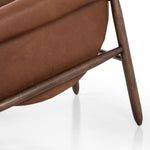 Featuring Reggie Heirloom Sienna Chair by Four Hands at Amethyst Home. Oversized cushioning brings a Brazilian midcentury feel to this vintage-inspired chair. Designed with cushion-wrapped slanted arms, fixed cushioning with a deep sit and narrow legs reminiscent of midcentury style. Sourced from one of the oldest family-owned tanneries in Italy's Bassano del Grappa, heirloom leathe. Amethyst Home provides interior design, new construction, custom furniture, and area rugs in the Boston metro area.