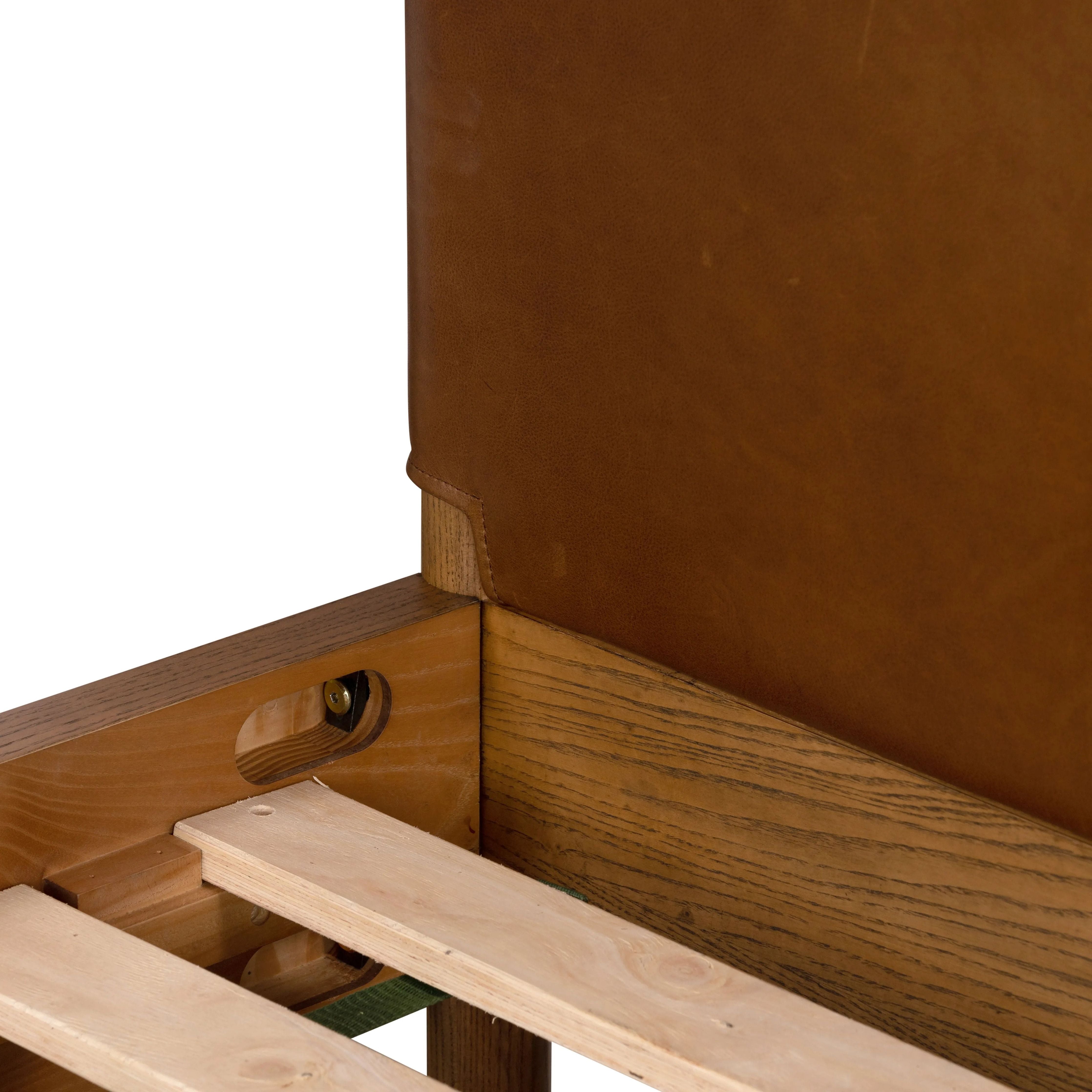 Solid ash framing and heirloom leather panel details craft this safari-inspired bed frame. Sourced from one of the oldest family-owned tanneries in Italyâ€™s Bassano del Grappa, our heirloom leather covering is salvaged and processed from upcycled hides featuring an abundance of natural markings, scars and color variations. Amethyst Home provides interior design, new home construction design consulting, vintage area rugs, and lighting in the Boston metro area.