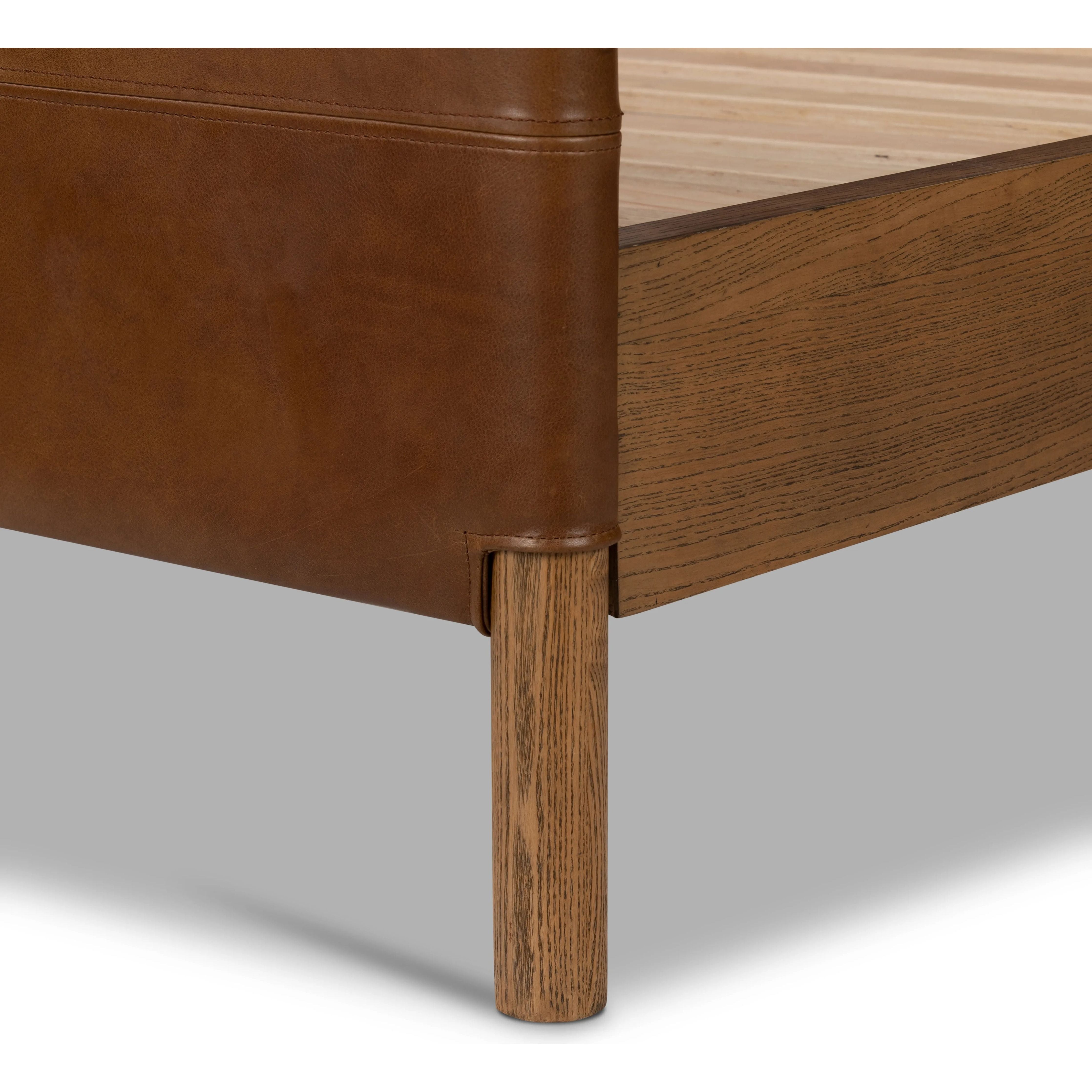 Solid ash framing and heirloom leather panel details craft this safari-inspired bed frame. Sourced from one of the oldest family-owned tanneries in Italyâ€™s Bassano del Grappa, our heirloom leather covering is salvaged and processed from upcycled hides featuring an abundance of natural markings, scars and color variations. Amethyst Home provides interior design, new home construction design consulting, vintage area rugs, and lighting in the Dallas metro area.