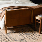 Solid ash framing and heirloom leather panel details craft this safari-inspired bed frame. Sourced from one of the oldest family-owned tanneries in Italyâ€™s Bassano del Grappa, our heirloom leather covering is salvaged and processed from upcycled hides featuring an abundance of natural markings, scars and color variations. Amethyst Home provides interior design, new home construction design consulting, vintage area rugs, and lighting in the Newport Beach metro area.