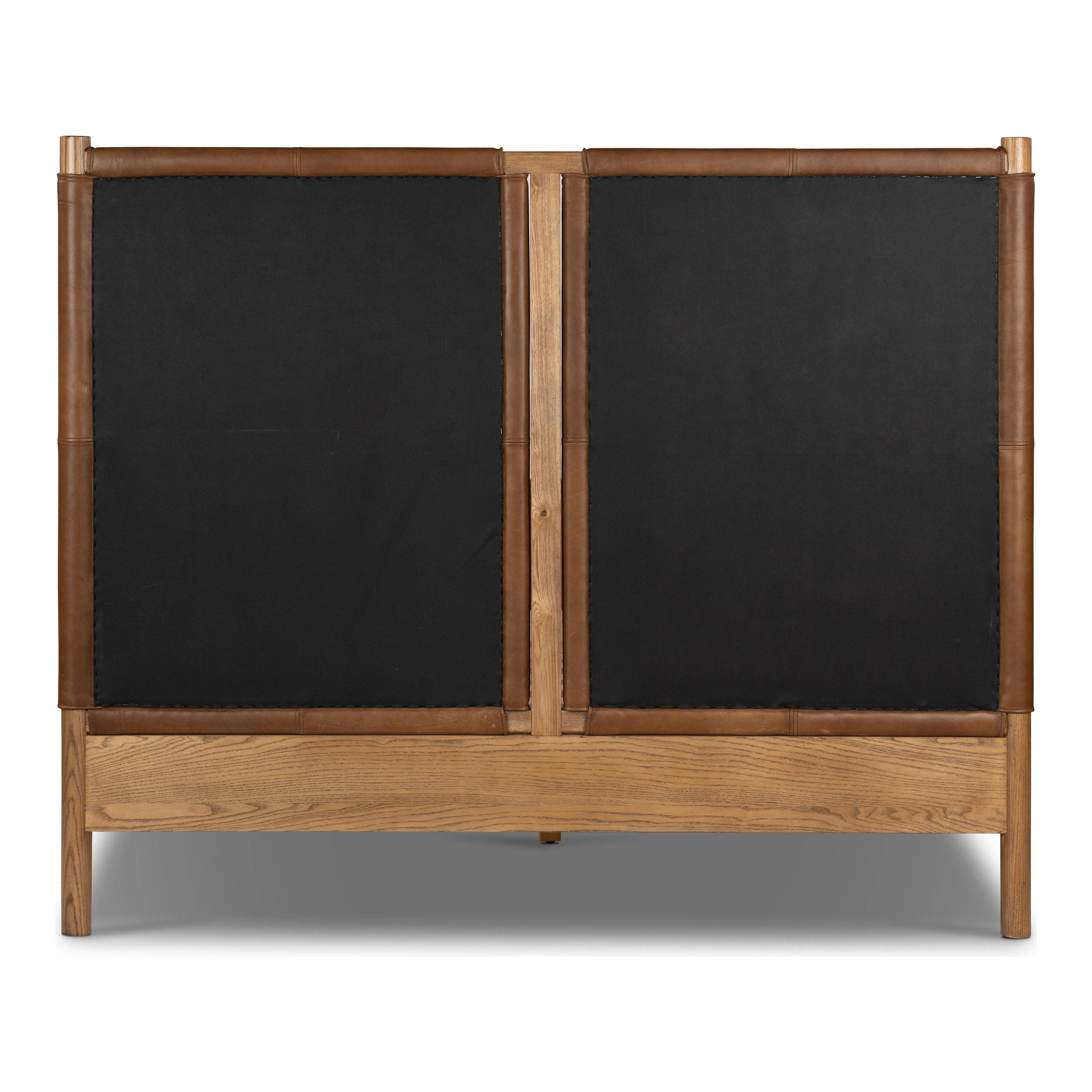 Solid ash framing and heirloom leather panel details craft this safari-inspired bed frame. Sourced from one of the oldest family-owned tanneries in Italyâ€™s Bassano del Grappa, our heirloom leather covering is salvaged and processed from upcycled hides featuring an abundance of natural markings, scars and color variations. Amethyst Home provides interior design, new home construction design consulting, vintage area rugs, and lighting in the San Diego metro area.