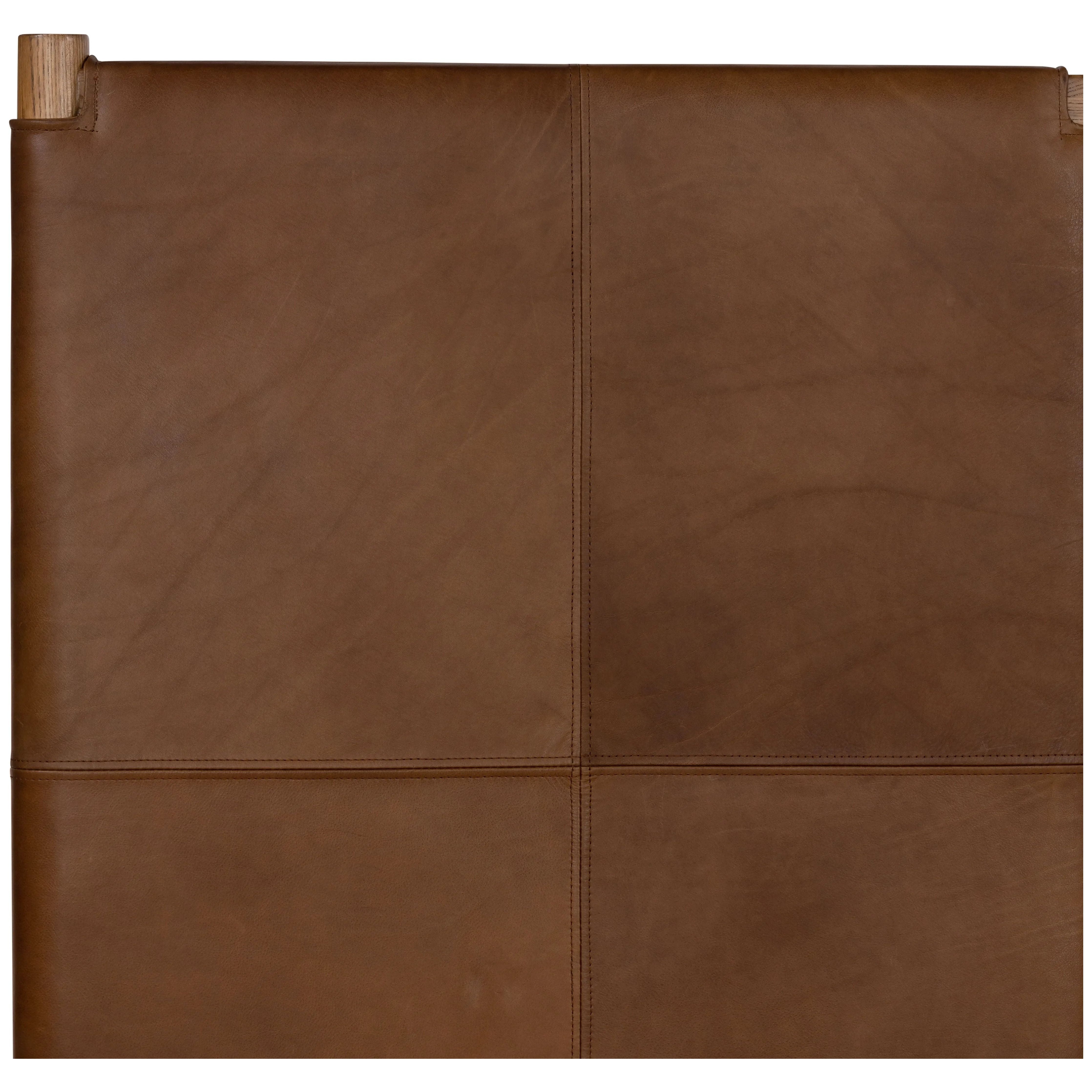 Solid ash framing and heirloom leather panel details craft this safari-inspired bed frame. Sourced from one of the oldest family-owned tanneries in Italyâ€™s Bassano del Grappa, our heirloom leather covering is salvaged and processed from upcycled hides featuring an abundance of natural markings, scars and color variations. Amethyst Home provides interior design, new home construction design consulting, vintage area rugs, and lighting in the Scottsdale metro area.