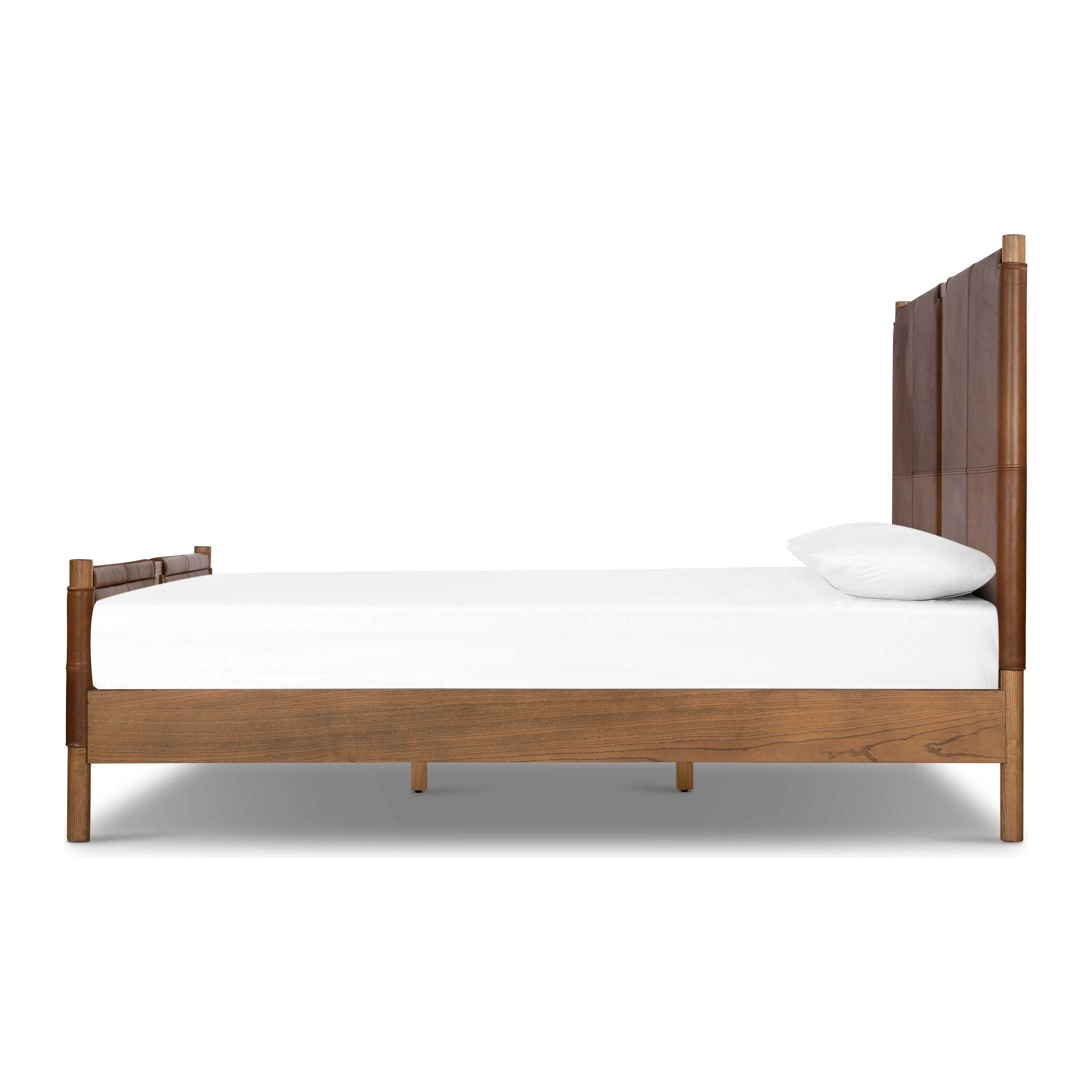 Solid ash framing and heirloom leather panel details craft this safari-inspired bed frame. Sourced from one of the oldest family-owned tanneries in Italyâ€™s Bassano del Grappa, our heirloom leather covering is salvaged and processed from upcycled hides featuring an abundance of natural markings, scars and color variations. Amethyst Home provides interior design, new home construction design consulting, vintage area rugs, and lighting in the Winter Garden metro area.