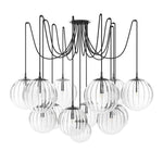 Featuring Spider Black Gunmetal Clear Ribbon Glass Cord Chandelier by Four Hands at Amethyst Home. Clear glass spheres float at varying lengths for a statement-making piece. Each globe is individually blown, shaped and sculpted by hand through a one-hour process. The finish on the brass frame is achieved through a specialized process that turns the brass. Amethyst Home provides interior design, new home construction design consulting, vintage area rugs, and lighting in the Laguna Beach metro area.