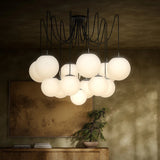 Featuring Spider Black Gunmetal Opal Matte Glass Cord Chandelier by Four Hands at Amethyst Home. Matte glass spheres float at varying lengths for a statement-making piece. Each globe is individually blown, shaped and sculpted by hand through a one-hour process. Matte glass is specially manufactured to evenly diffuse light. The finish on the brass frame is achie. Amethyst Home provides interior design, new home construction design consulting, vintage area rugs, and lighting in the Tampa metro area.