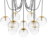 Featuring Spider Burnished Brass Clear Ribbon Glass Cord Chandelier by Four Hands at Amethyst Home. Clear glass spheres float at varying lengths for a statement-making piece. Each globe is individually blown, shaped and sculpted by hand through a one-hour process. Brass and glass are 98% recyclable. Designed and sustainably crafted in Poland by Schwung.. Amethyst Home provides interior design, new home construction design consulting, vintage area rugs, and lighting in the Winter Garden metro area.
