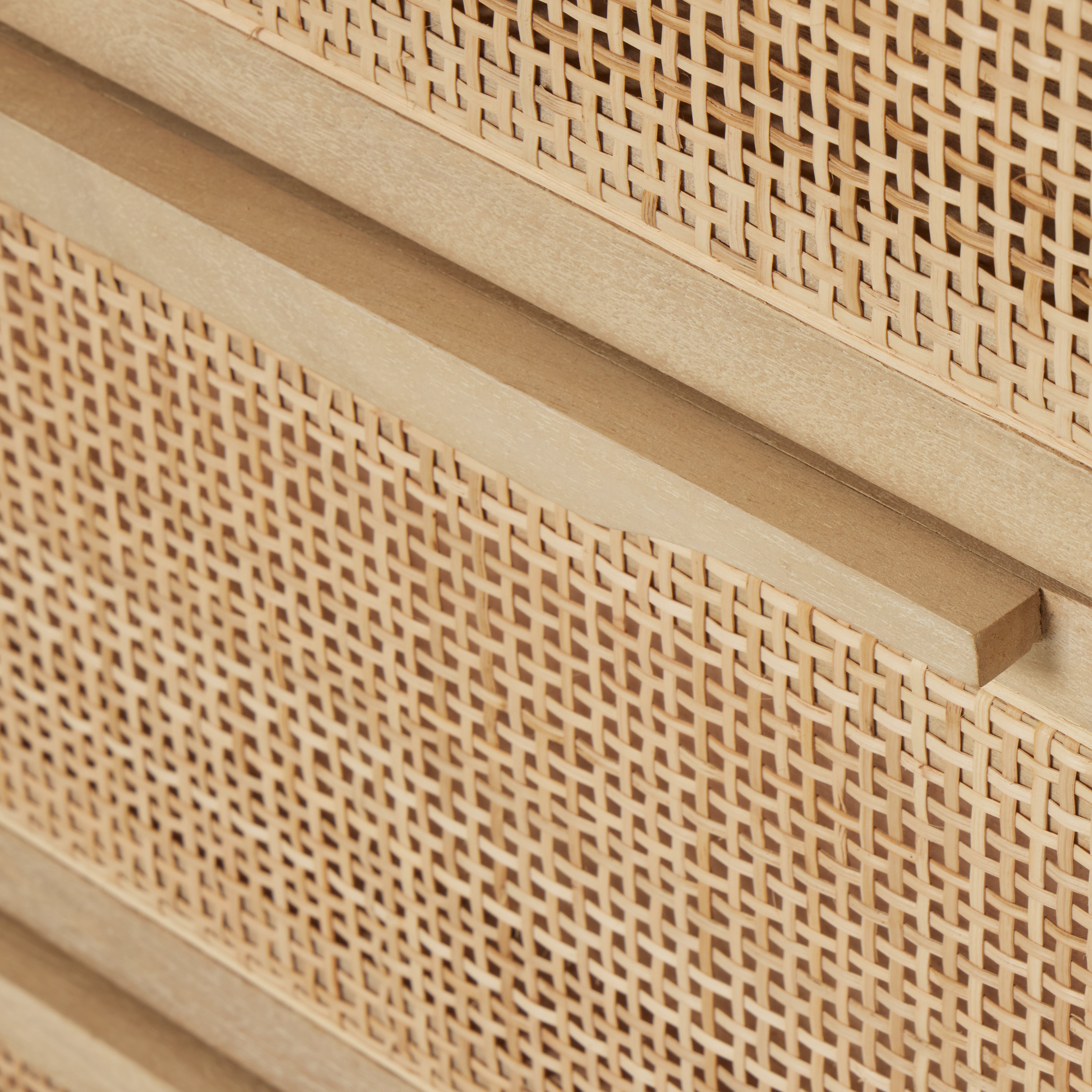 Natural mango encases nine spacious drawers of woven cane, for a textural look with eye-catching contrast. Amethyst Home provides interior design, new construction, custom furniture, and area rugs in the Newport Beach metro area.
