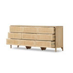 Natural mango encases nine spacious drawers of woven cane, for a textural look with eye-catching contrast. Amethyst Home provides interior design, new construction, custom furniture, and area rugs in the Seattle metro area.