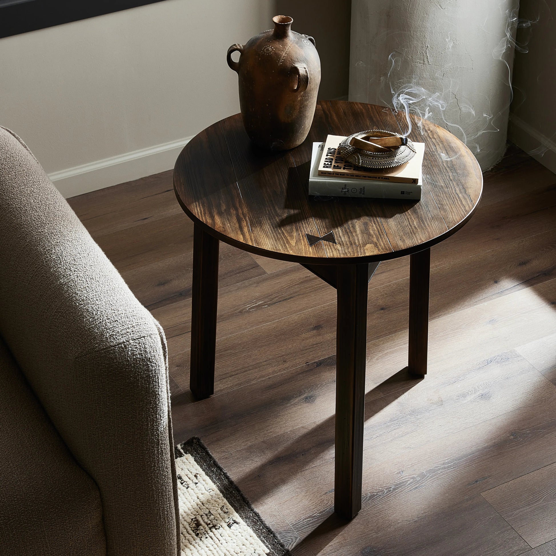 Brown-finished pine forms a versatile three-legged end table with a playful feel. By the makers at Van Thiel, known for their antique-inspired pieces and hand-applied finishes.Collection: Van Thie Amethyst Home provides interior design, new home construction design consulting, vintage area rugs, and lighting in the Winter Garden metro area.