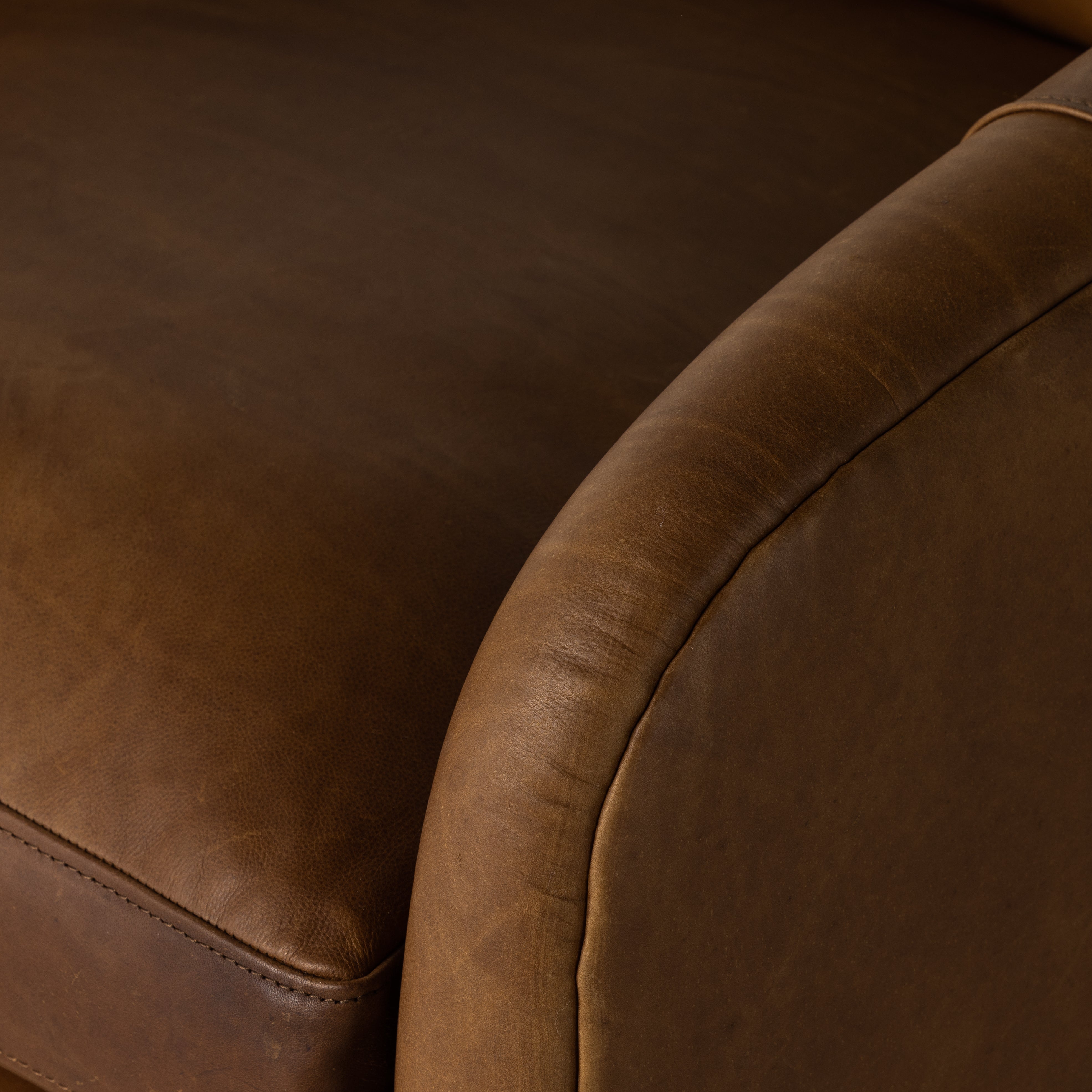 Angled arms and a single pillow create a laid-back look, with a 360-degree swivel for ease in your office or living room. Sourced from one of the oldest family-owned tanneries in Italyâ€™s Bassano del Grappa, our top-grain heirloom leather covering is salvaged and processed from upcycled hides featuring an abundance of natural markings, scars and color variations. Amethyst Home provides interior design, new construction, custom furniture, and area rugs in the Los Angeles metro area.