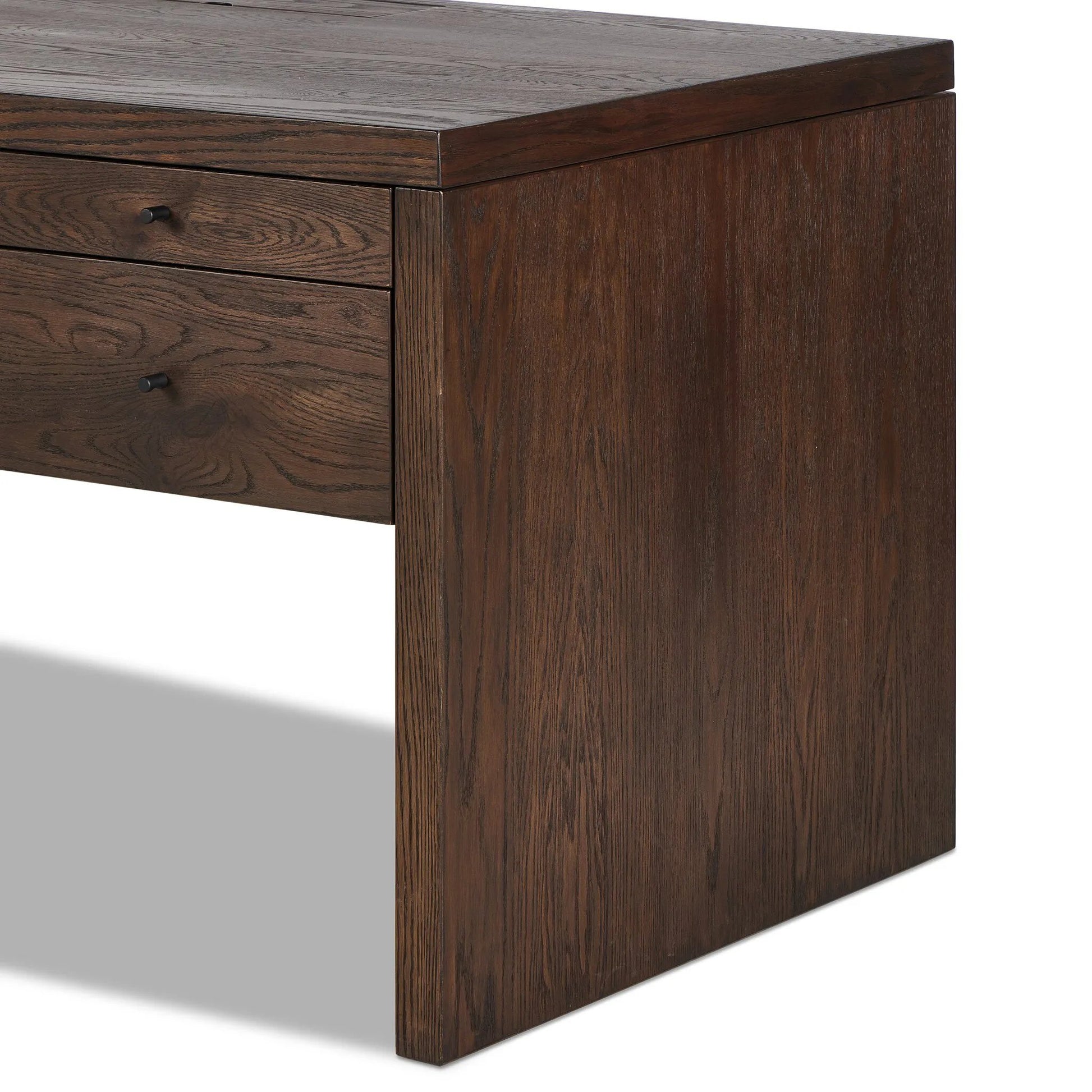 An executive-sized desk of rich brown oak offers generous surface and storage space, while a flip top keeps cords out of sight. Invisible wireless charging for Android and Apple products.Collection: Hamilto Amethyst Home provides interior design, new home construction design consulting, vintage area rugs, and lighting in the Houston metro area.