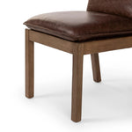 Featuring Wilmington Tan Oak Dining Chair by Four Hands at Amethyst Home. Inspired by the folded pillow form, the seat and back cushions of this oak dining chair are covered in brown top-grain leather. The chair back features leather strap details for a mixed material touch.Collection: AshfordColors: Tan Oak ,Havana BrownMaterials: Solid Oak ,Top Grain Leat. Amethyst Home provides interior design, new home construction design consulting, vintage area rugs, and lighting in the Charlotte metro area.