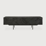 In his quest to add movement to the surface, our designer Alain van Havre started layering and combining triangular shapes. Before he knew it, he had created an interesting composition out of teak. Originally used for our popular Teak Graphic sideboard, the pattern now translates perfectly to a new TV cupboard. Amethyst Home provides interior design services, furniture, rugs, and lighting in the Omaha metro area.