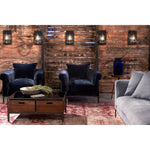 Featuring Henrietta Upholstered Chair by Cisco Brothers at Amethyst Home. The Henrietta Chair by Cisco Brothers is the ideal mid-century accent to your living room style. This dashing piece boasts a distinctive style, with elegant roll arms and metal black-rust legs. This chair is a fresh look on a classic style, updating the familiar silhouette with a uni.  Amethyst Home provides interior design, new home construction design consulting, vintage area rugs, and lighting in the San Diego metro area.