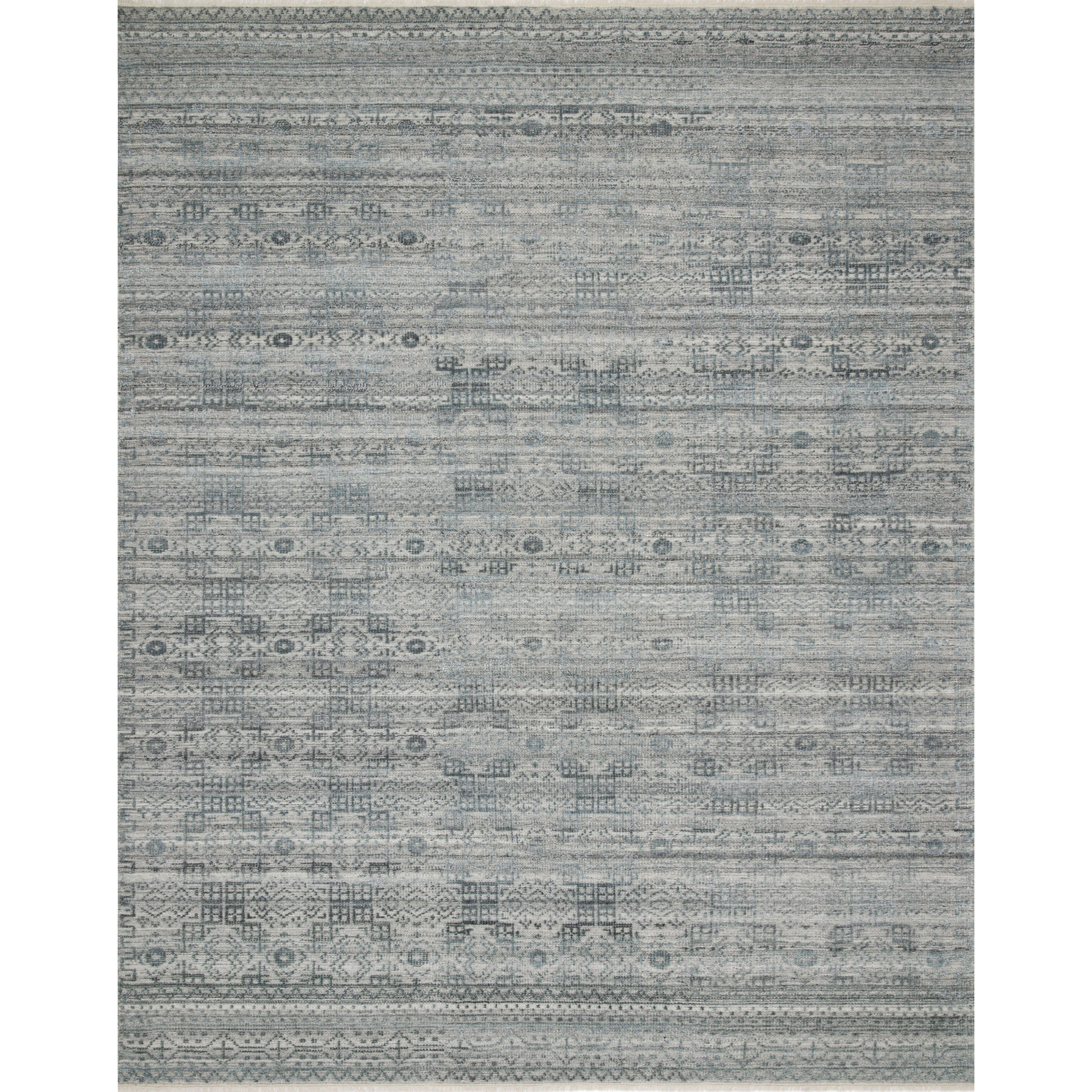 Both timeless and modern, the Idris Spa area rug from Loloi is meticulously hand-knotted in colors of blue, grey, and ivory. The tonal series features an elevated texture, accentuating the detailed pattern. The Idris Spa rug, also known as ID-03 Spa, is hand-knotted of 70% Viscose and 30% Wool.