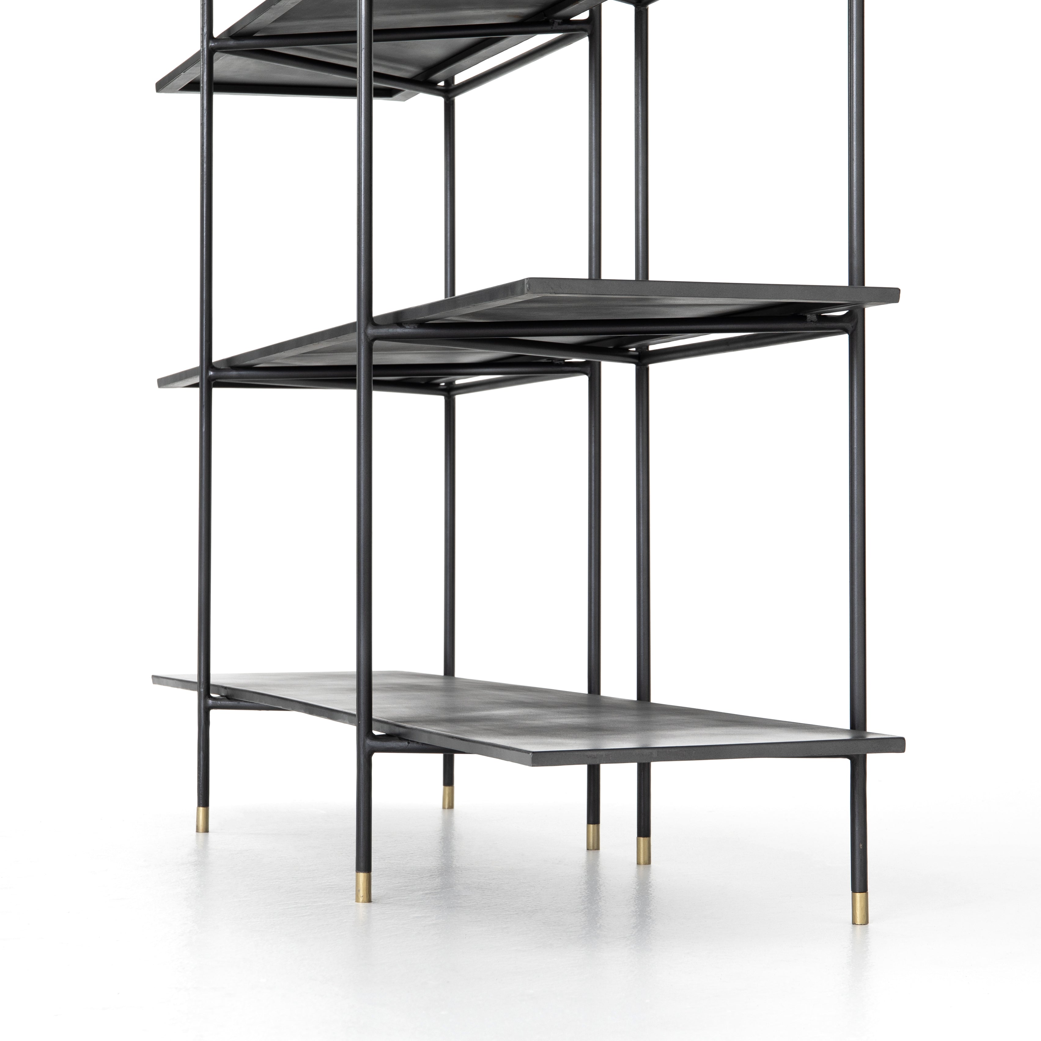 Featuring Vito Bookshelf by Four Hands at Amethyst Home. Modern industrial design gets softened by fine lines with this Vito Bookshelf. Wide planks of distressed iron offer plenty of space for the display of books and treasured items. Brass-capped feet add a feminine finishing touch.
Overall Dimensions: 63"W x 16.5"L x 71"H
Colors: Distressed Iron, Brass Pa.  Amethyst Home provides interior design, new home construction design consulting, vintage area rugs, and lighting in the Monterey metro area.
