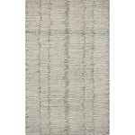 Hand-crafted with a combination of thick and fine yarns, the Tallulah Stone / Ivory Rug area rug creates dynamic dimension in living rooms, bedrooms, and more. The thicker yarns define the abstract, linear design, giving the rug a distinct high-low texture and sense of movement. Tallulah's soft, neutral palettes have a depth of tone inspired by watercolor pigmentation. Amethyst Home provides interior design, new construction, custom furniture, and area rugs in the Miami metro area.