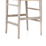 Modern curves redefine the classic wishbone-style counter stool. Vintage white all-weather wicker is woven for a dose of fresh texture within weathered grey teak framing. Cover or store indoors during inclement weather and when not in use.  Pictured in Weathered Grey. Also available in Black Teak and Matte Sealed Teak.  Overall Size: 21.50"w x 22.50"d x 38.50"h Seat Depth: 18.25" Seat Height: 26.50"