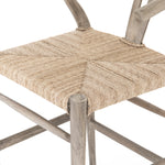 Modern curves redefine the classic wishbone-style counter stool. Vintage white all-weather wicker is woven for a dose of fresh texture within weathered grey teak framing. Cover or store indoors during inclement weather and when not in use.  Pictured in Weathered Grey. Also available in Black Teak and Matte Sealed Teak.  Overall Size: 21.50"w x 22.50"d x 38.50"h Seat Depth: 18.25" Seat Height: 26.50"