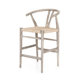 Modern curves redefine the classic wishbone-style counter stool. Vintage white all-weather wicker is woven for a dose of fresh texture within weathered grey teak framing. Cover or store indoors during inclement weather and when not in use.  Pictured in Weathered Grey. Also available in Black Teak and Matte Sealed Teak.  Overall Size: 21.50"w x 22.50"d x 38.50"h Seat Depth: 18.25" Seat Height: 26.50"