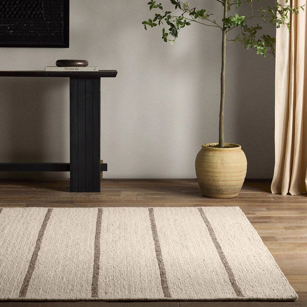 Featuring Bavell Almeda Rug by Jaipur Living at Amethyst Home. With its mesmerizing waves of 100% premium undyed artisanal wool, Norfolk adds an earthy, elemental ease to any modern interior. In unique combinations of creams and browns, the weaver’s impromptu selection of undyed yarn results in unexpected flecks of gray. Enjoy effortless style, and unsurpas. Amethyst Home provides interior design, new home construction design consulting, vintage area rugs, and lighting in the Calabasas metro area.