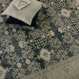 The Boheme Pia Rug brings vintage inspiration to life with ornate, worldly designs and a timeless distress effect. The Pia area rug boasts a Persian-inspired center medallion, short fringe and detail-rich border in a navy, cream, gray, and pastel green colorway. Amethyst Home provides interior design services, furniture, rugs, and lighting in the Seattle metro area.