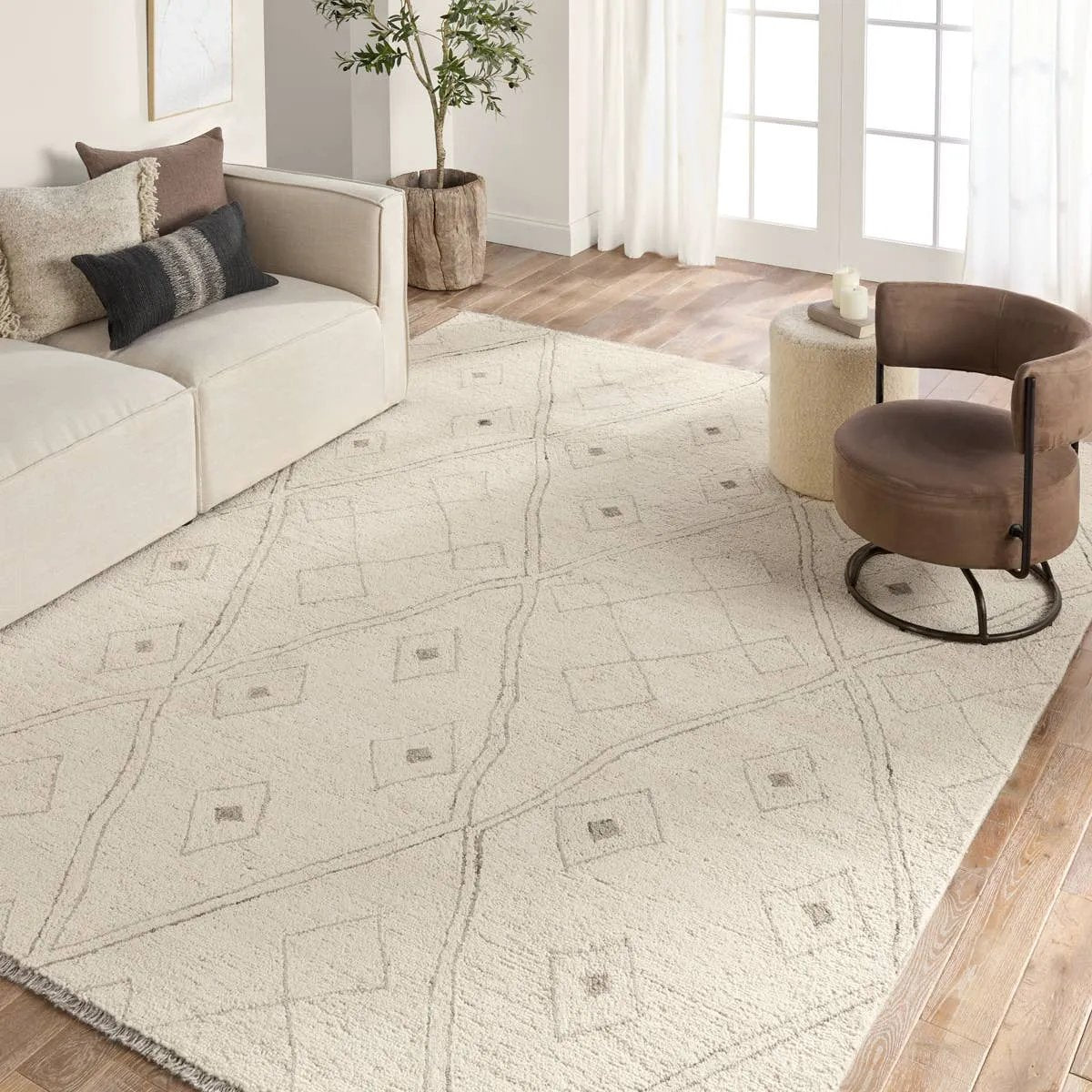 Featuring Hadi Ismael Rug by Jaipur Living at Amethyst Home. The hand-tufted Hadi Ismael introduces fresh looks inspired by modern Moroccan patterns and neutral colorways. The Ismael design features overlapping stripes in cream and gray hues. Short, gray fringe and 100% wool pile adds to the global appeal. This rug is naturally stain-resistant and works bes. Amethyst Home provides interior design, new home construction design consulting, vintage area rugs, and lighting in the Park City metro area.